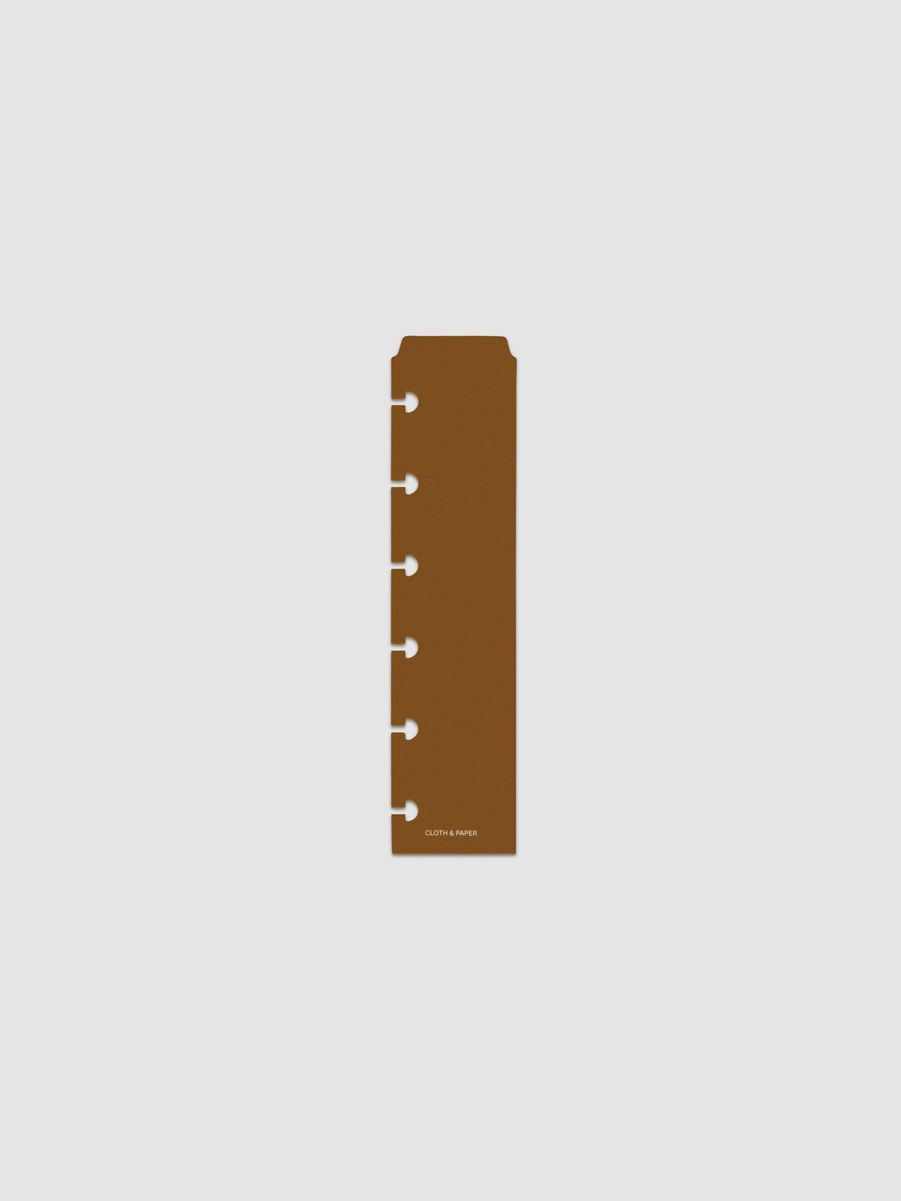One narrow page marker in brown, shown in size CP Petite.