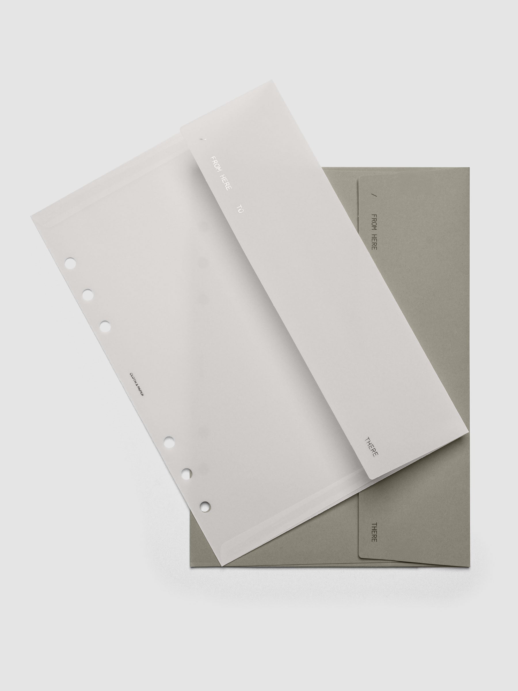 Envelope Storage Holder Set shown pre-punched for A5 6-Ring planners.