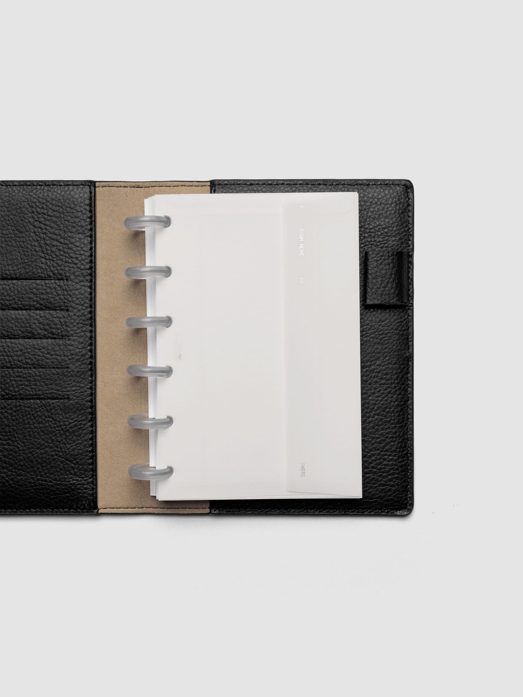White Envelope Storage Holder shown inside a black, leather CP Petite folio.