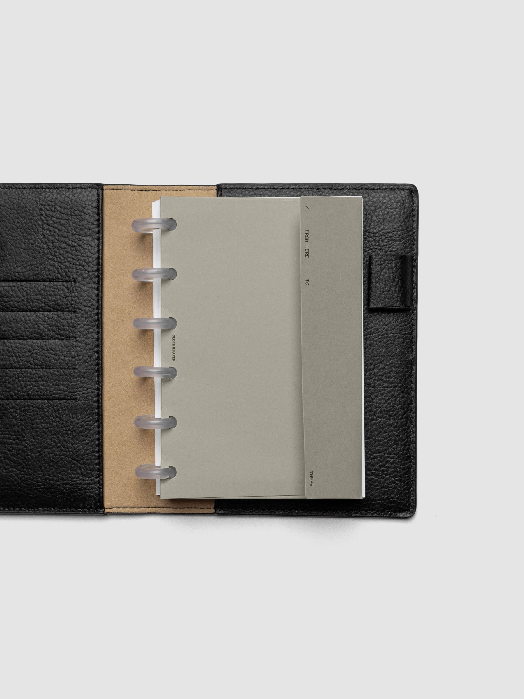 Beige Envelope Storage Holder shown inside a black, leather CP Petite folio.
