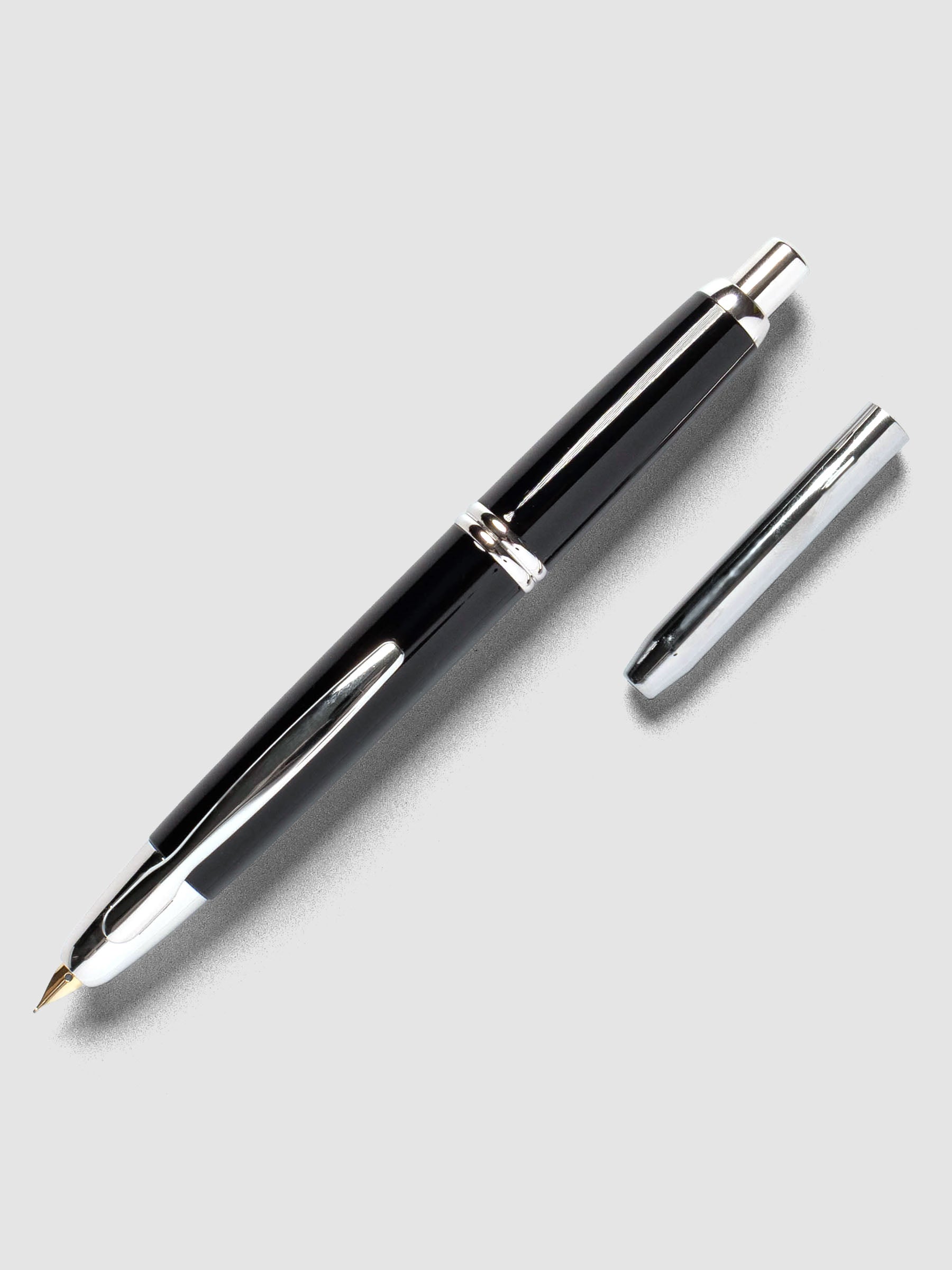 Black Rhodium Pilot Vanishing Point Fountain Pen with cap off on a neutral background.