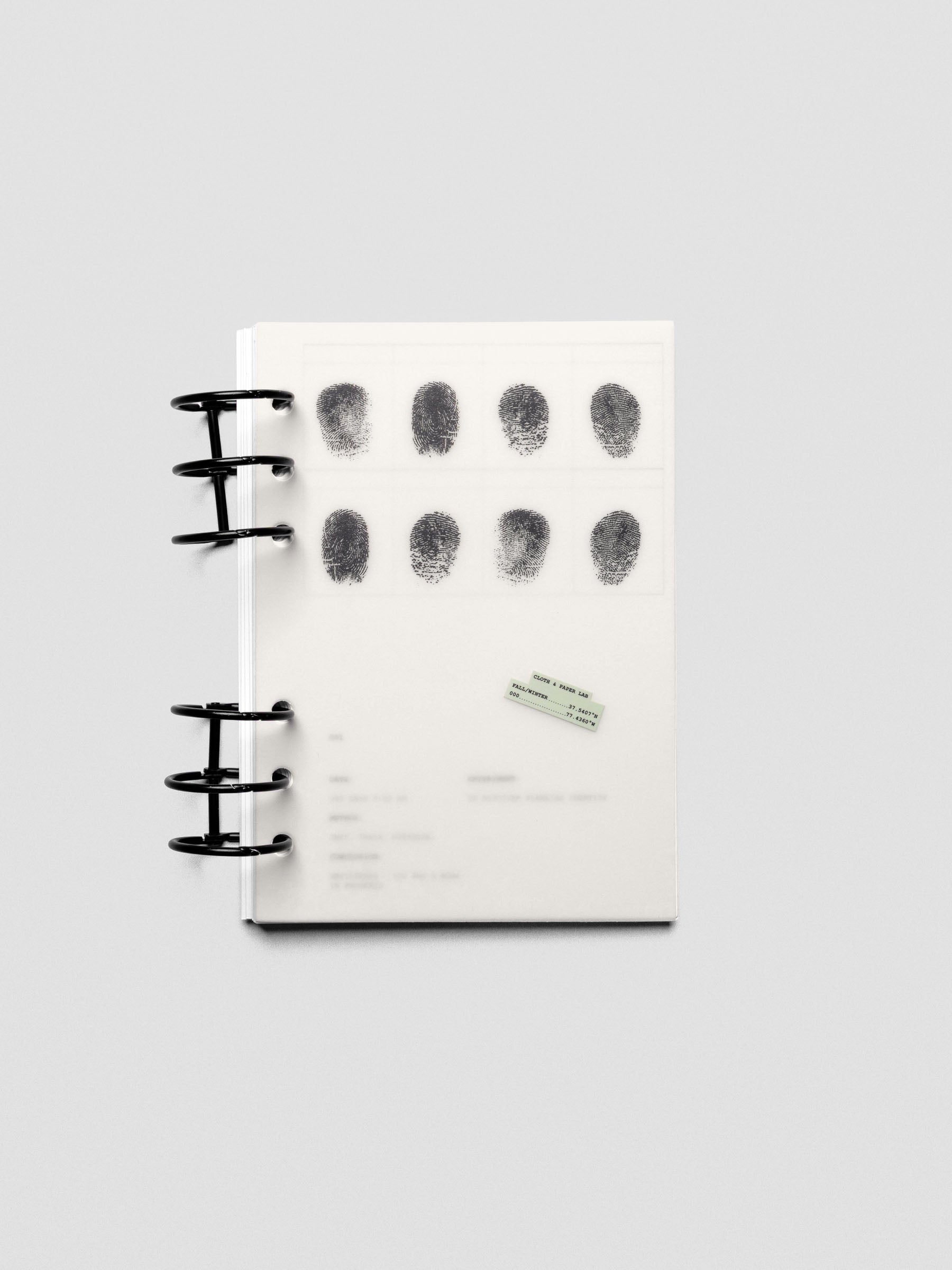 Two layered Personal Wide sized planner dashboards, one semi-transparent, one matte, featuring a fingerprint design shown in a ring bound planner.