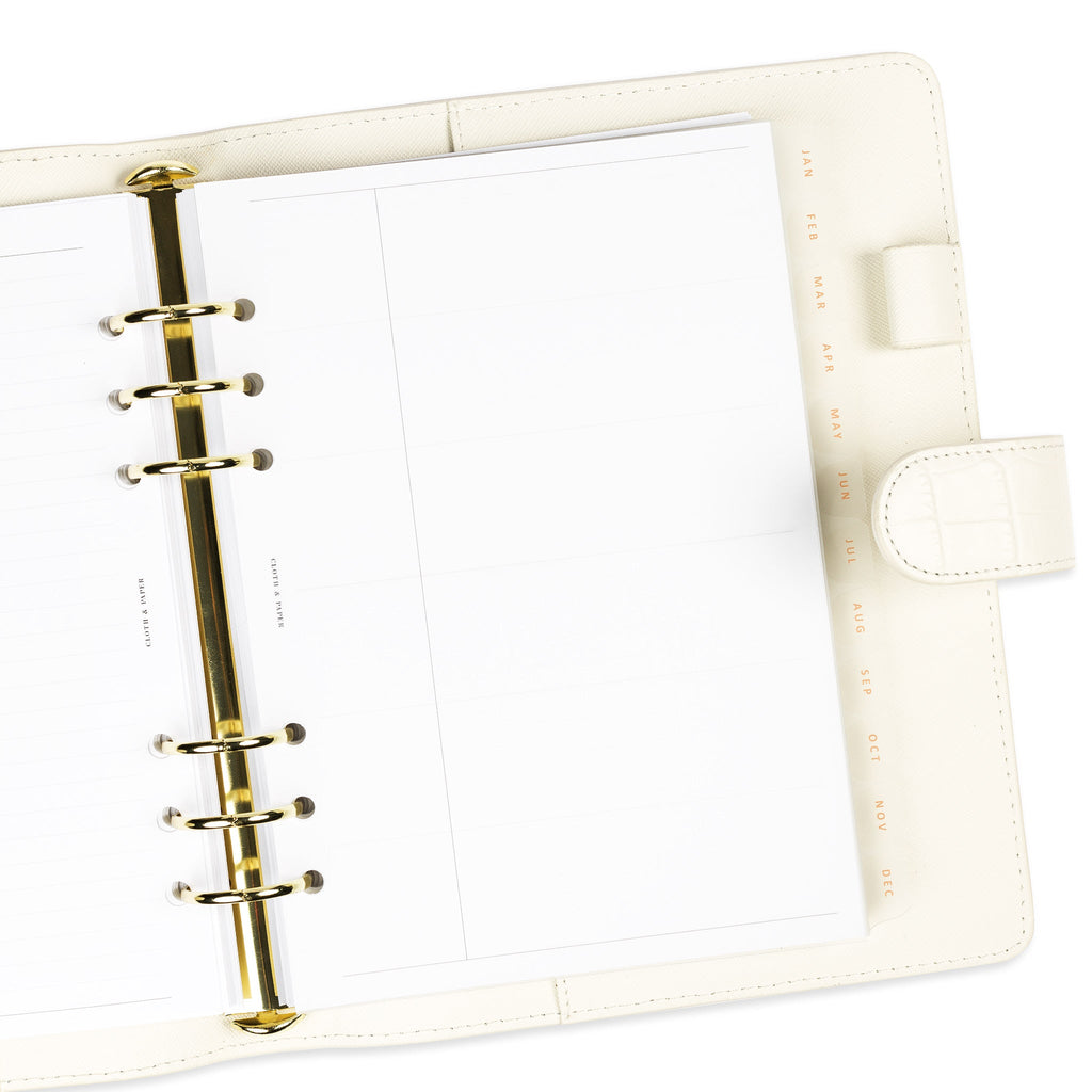 Dividers in use inside a white 6-ring leather agenda.
