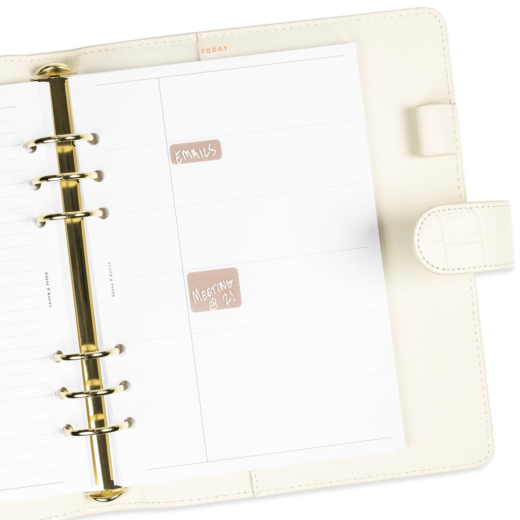 Today tab divider in use inside a white leather 6-ring planner agenda. There are sticky notes placed behind it to show its transparency and sample text is written on the divider with white dry-erase ink.