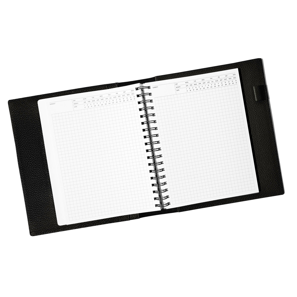 Notebook spread open inside a black leather agenda. Design shown is executive notes.