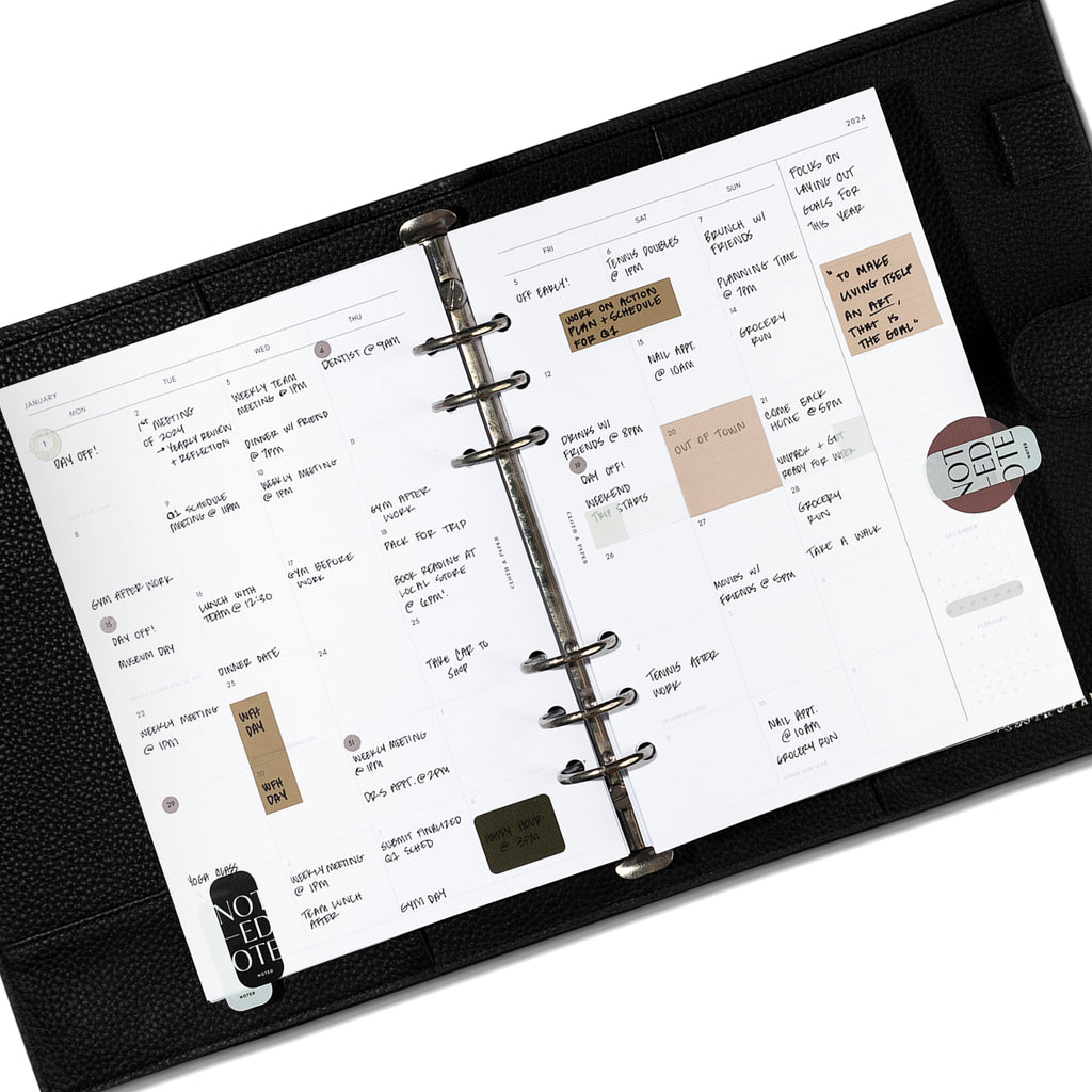 A5 insert spread shown in use inside a black leather agenda.