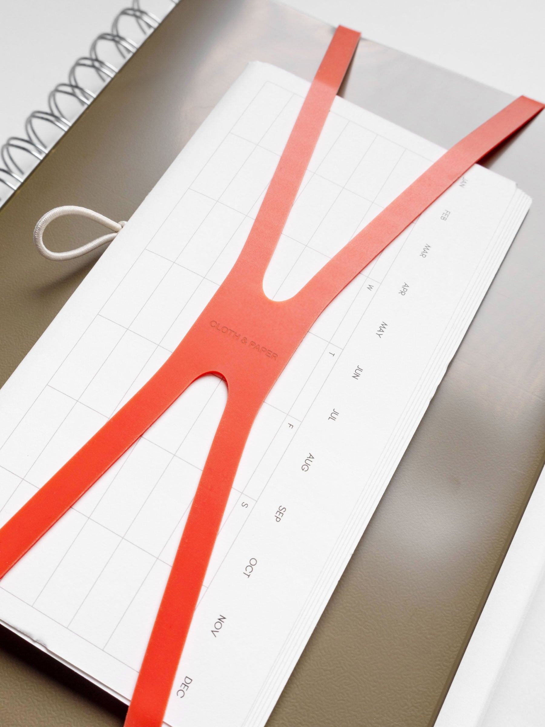 Set of three notebooks displayed on a neutral background.