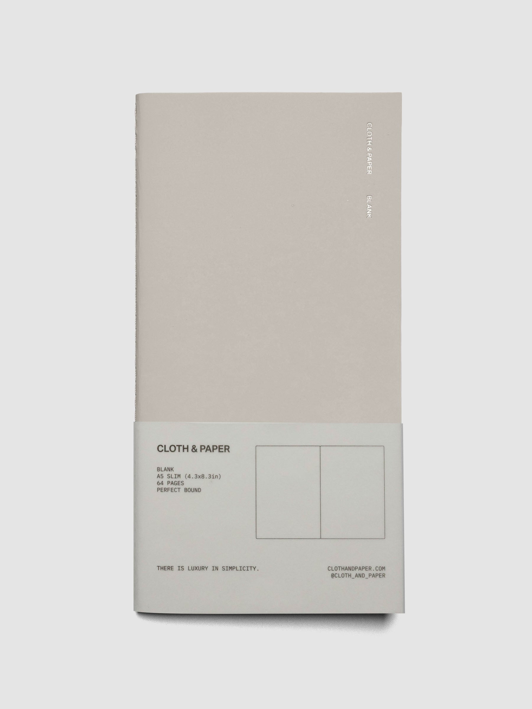 Travel Notebook in size A5 Slim in color Angora with Blank pages shown closed in packaging.