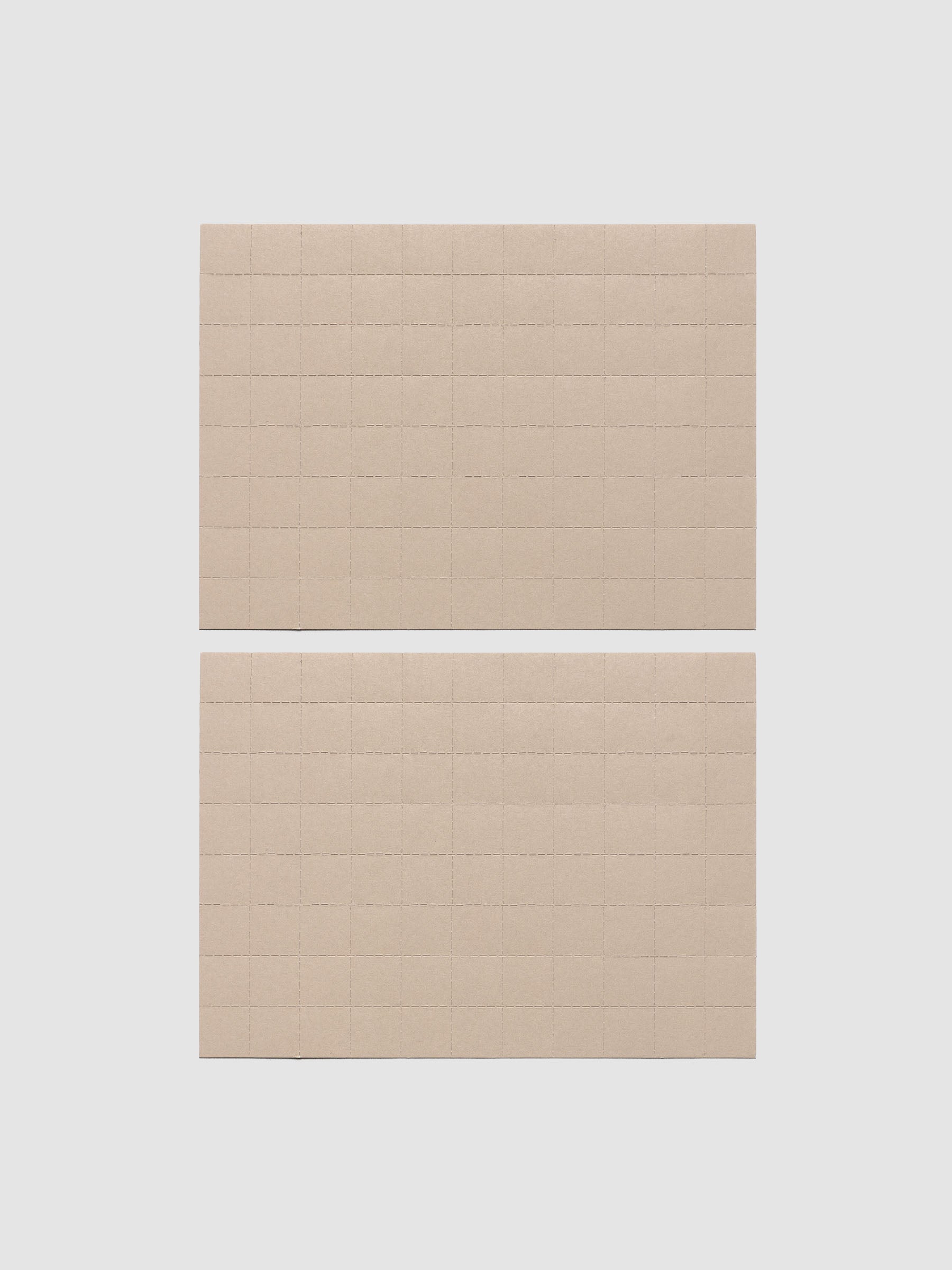 Two sheets of beige tear-off stickers