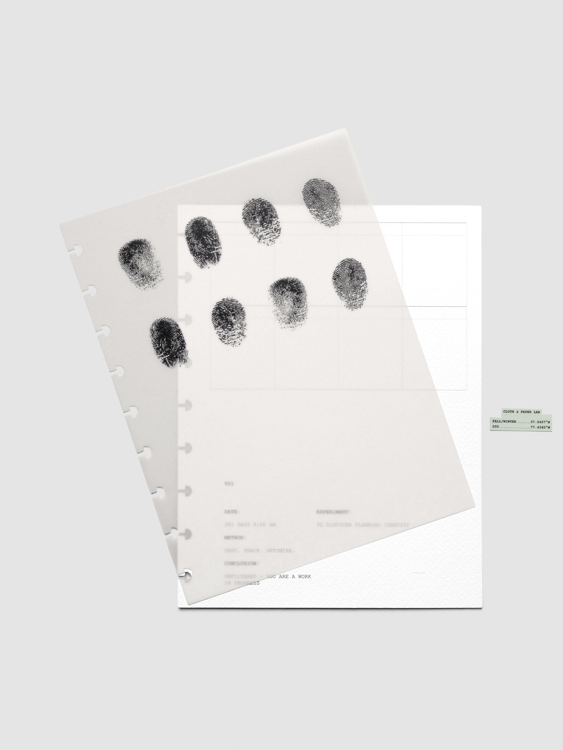 Two layered HP Classic sized planner dashboards, one semi-transparent, one matte, featuring a fingerprint design shown offset from one another.