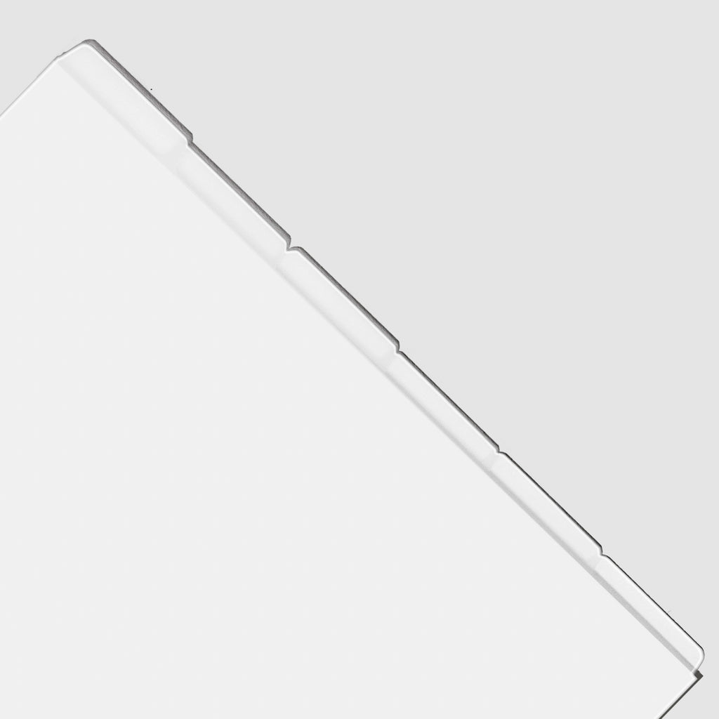 Closeup of blank divider tabs on a white background.
