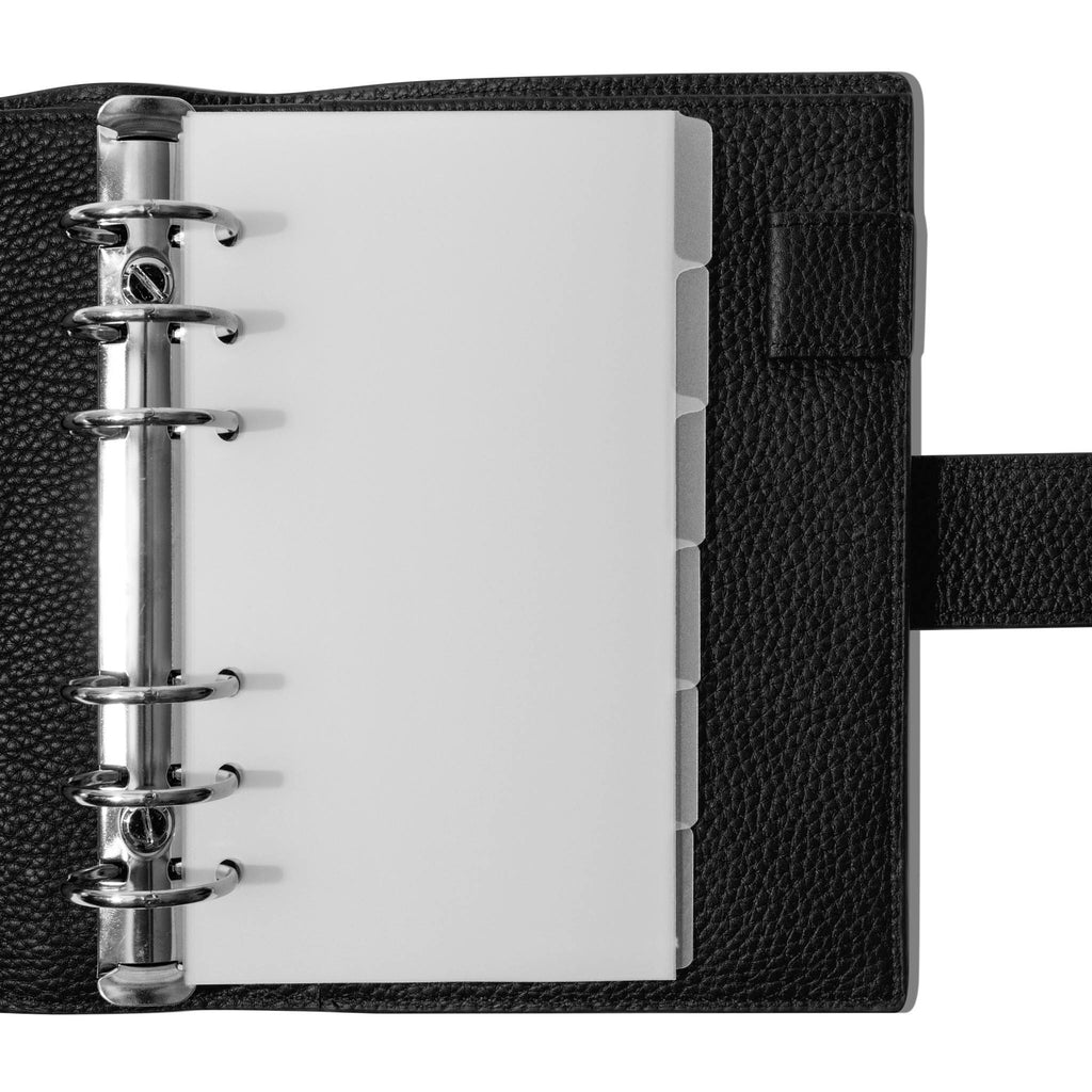 Personal Blank side tabs shown in use inside a black leather planner.