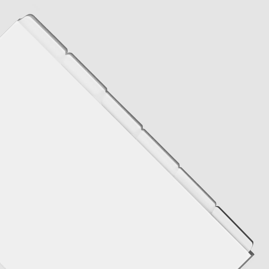 Closeup of blank divider tabs on a white background.