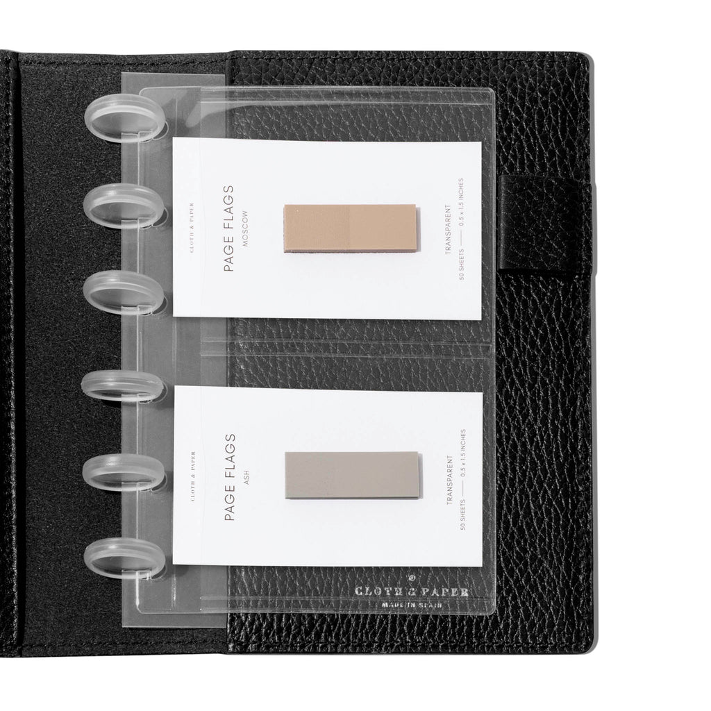 Credit card holders in use inside a black leather folio. Page flags are stored in the open pockets. Size shown is CP Petite. 