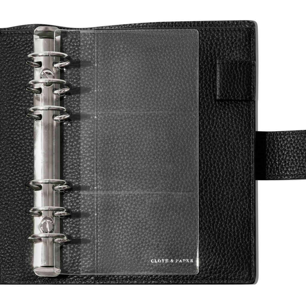 Credit card holders in use inside a black leather folio. Size shown is Personal. 