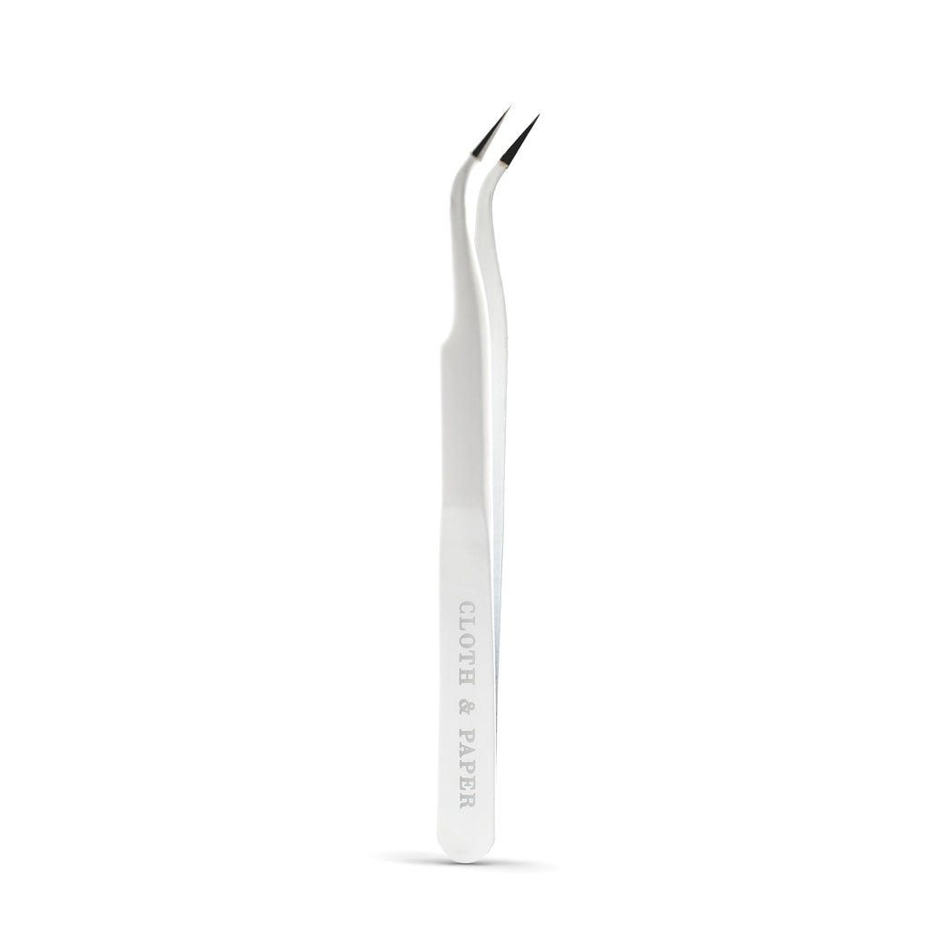 White tweezers displayed on a white background.