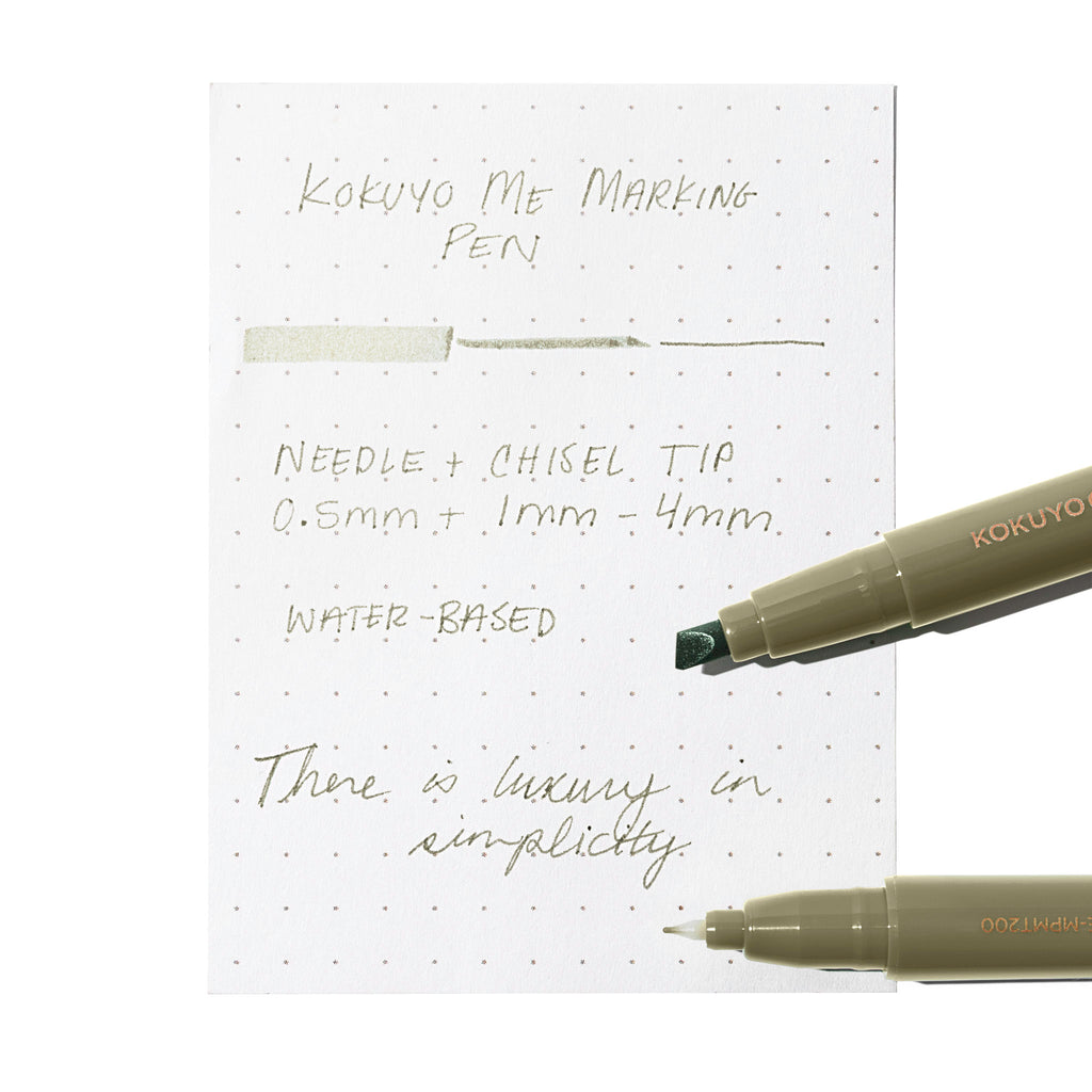 Two markers, showing the nib and chisel tips respectively, rest on an in use pen testing sheet. Color shown is Dusty Olive. 