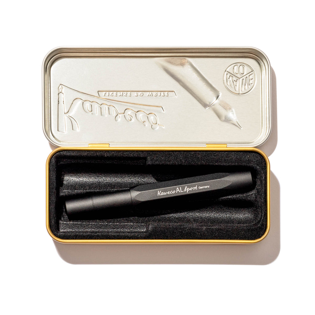 Kaweco AL Sport Fountain Pen, Black, Extra Fine Nib, Cloth and Paper. Pen displayed in its tin case on a white background.