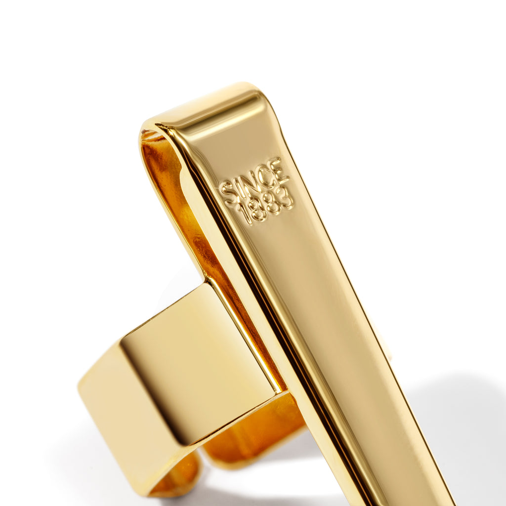 Standard gold clip displayed on a white background. Closeup of text reads "Since 1883"
