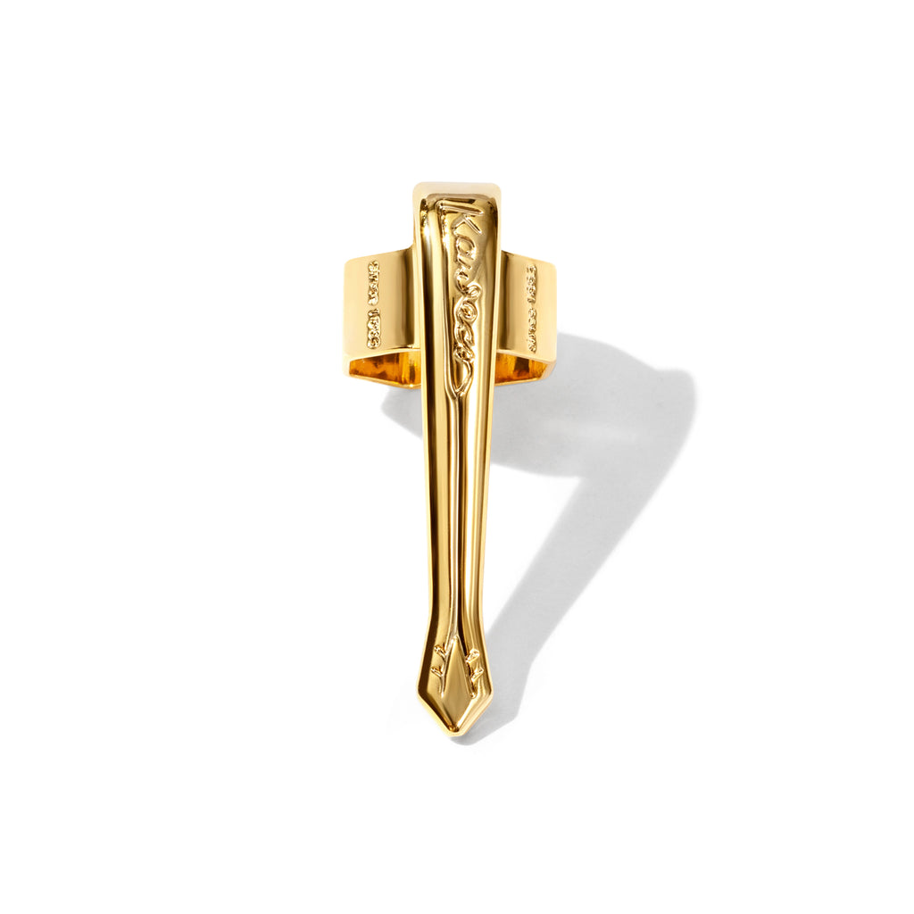 Nostalgic  gold clip displayed on a white background.