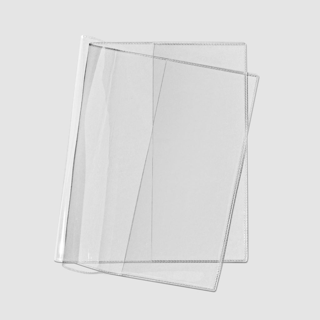 Clear vinyl notebook cover photographed on a neutral background.