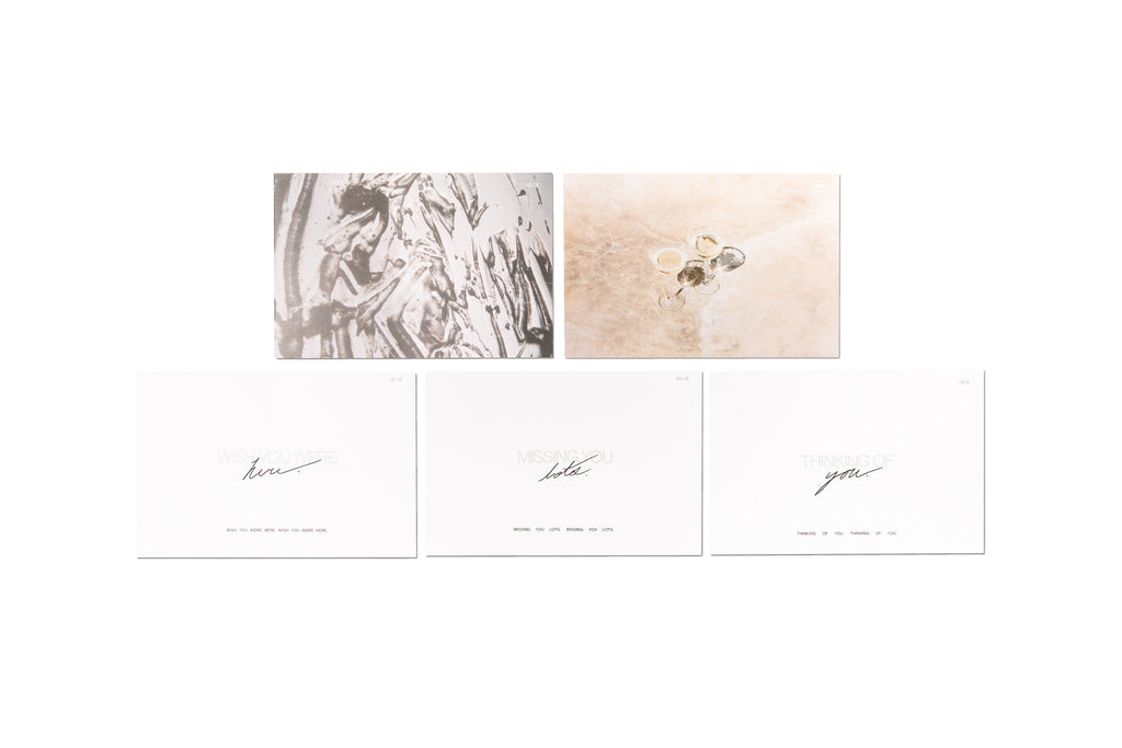Postcard Set, Cloth and Paper. Set of 5 posctards on a white background. Two are full color abstract photography, and three have handwritten text on a blank white background.