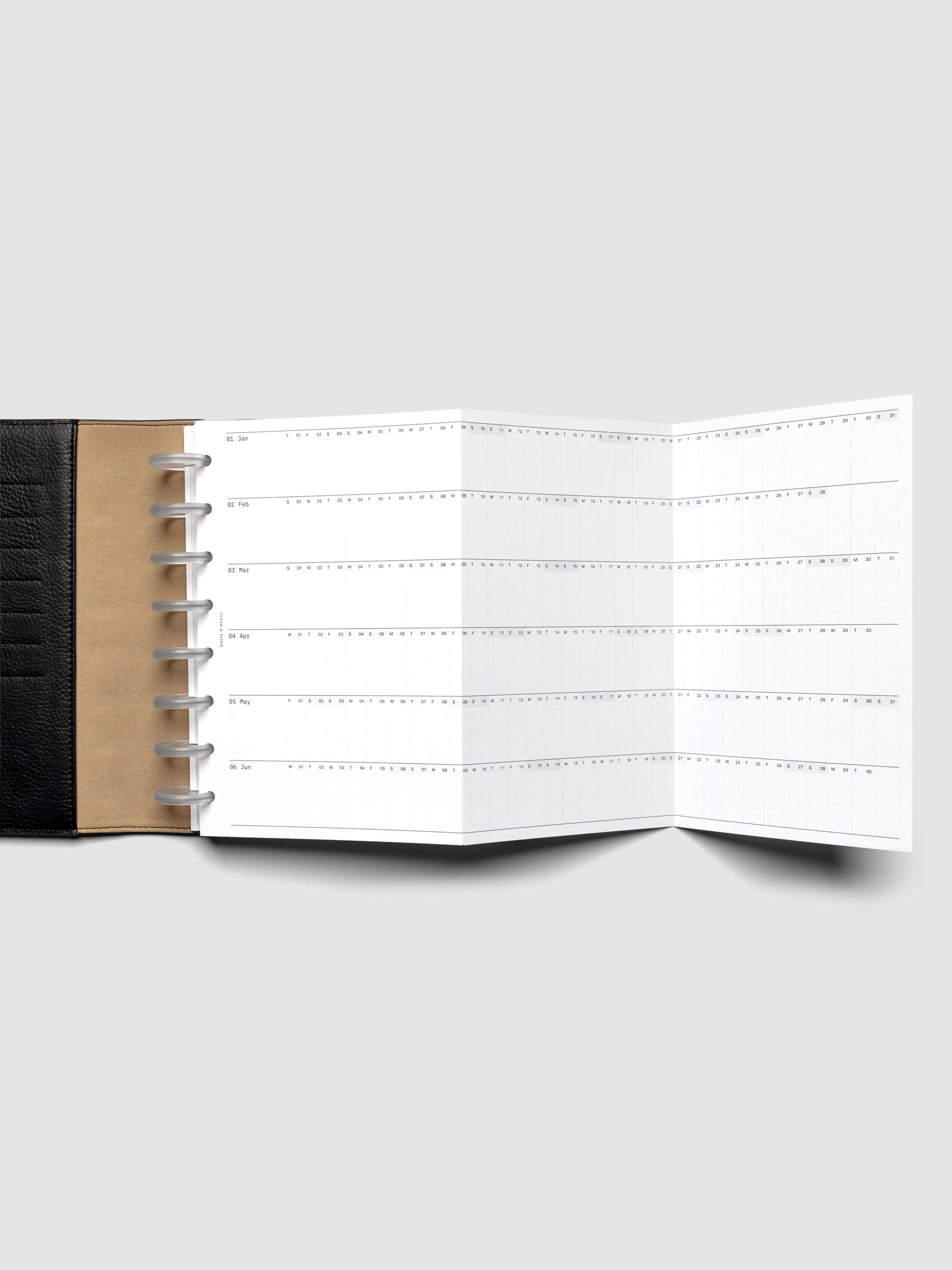 2026 Yearly Fold Out Planner Insert in size Half Letter shown un-folded in a black leather folio cover.
