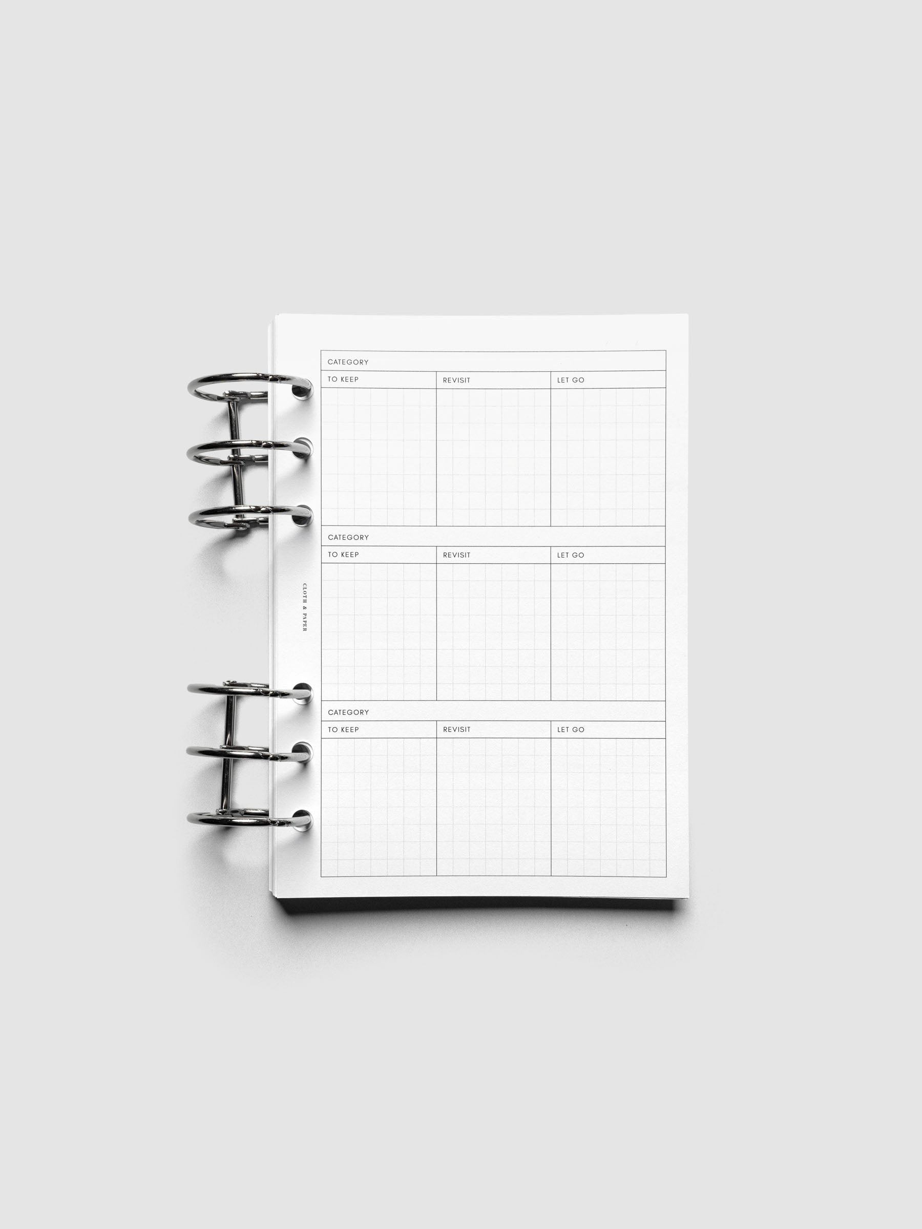 Declutter Planner Inserts in size Personal Wide shown ring bound.