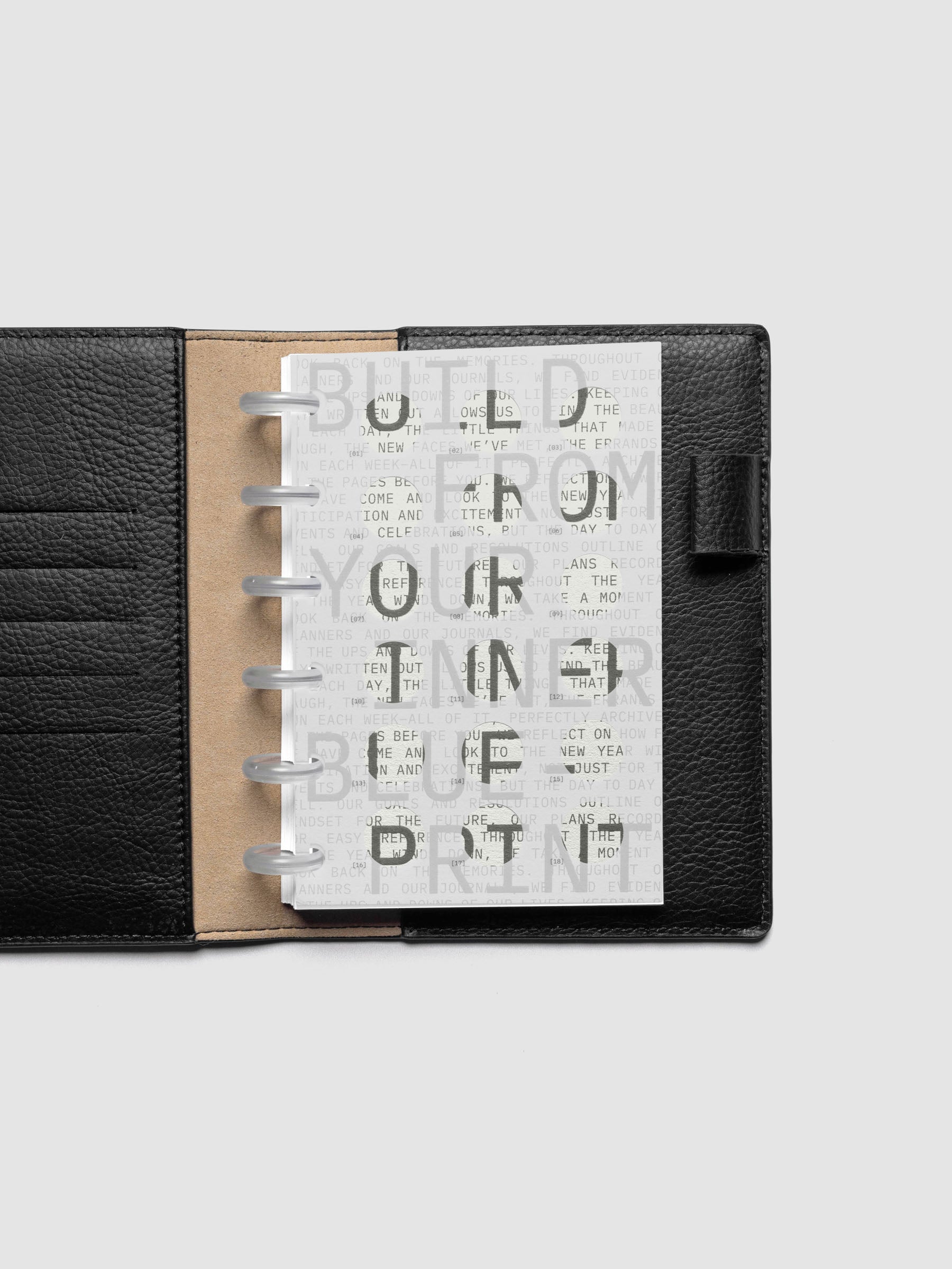 Inner Blueprint Dashboard Duo shown ring bound in a black leather folio in size CP Petite.