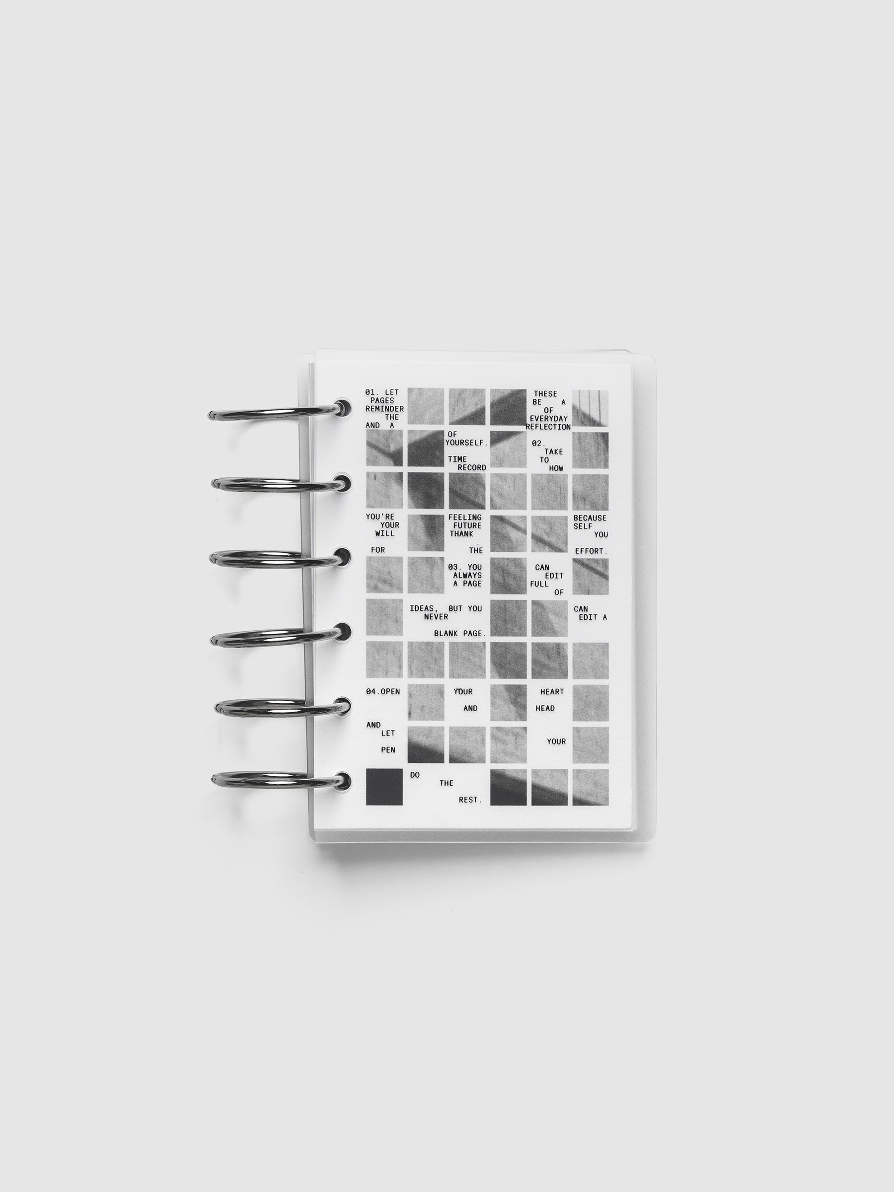 Clear planner cover with black printed text paired with a photographic black and white dashboard. Shown pre-punched for 6-ring planners in the size Pocket.