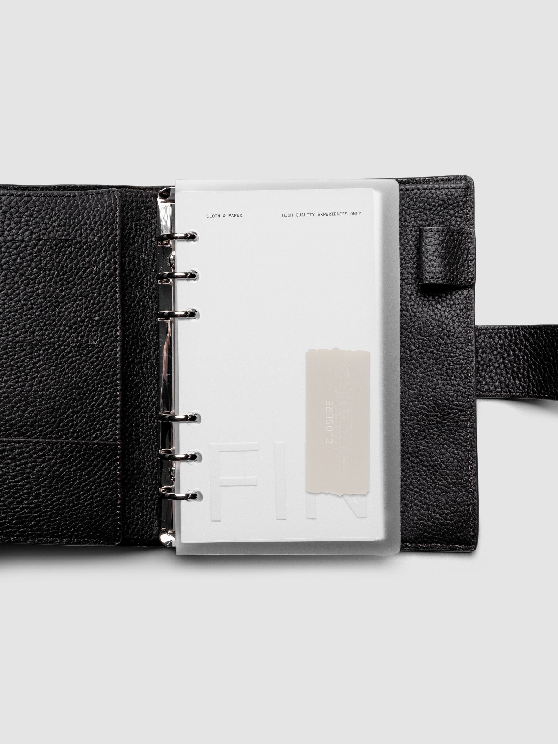 Closure Planner Dashboard + Cover Set in size Personal shown ring bound in a black leather agenda cover.