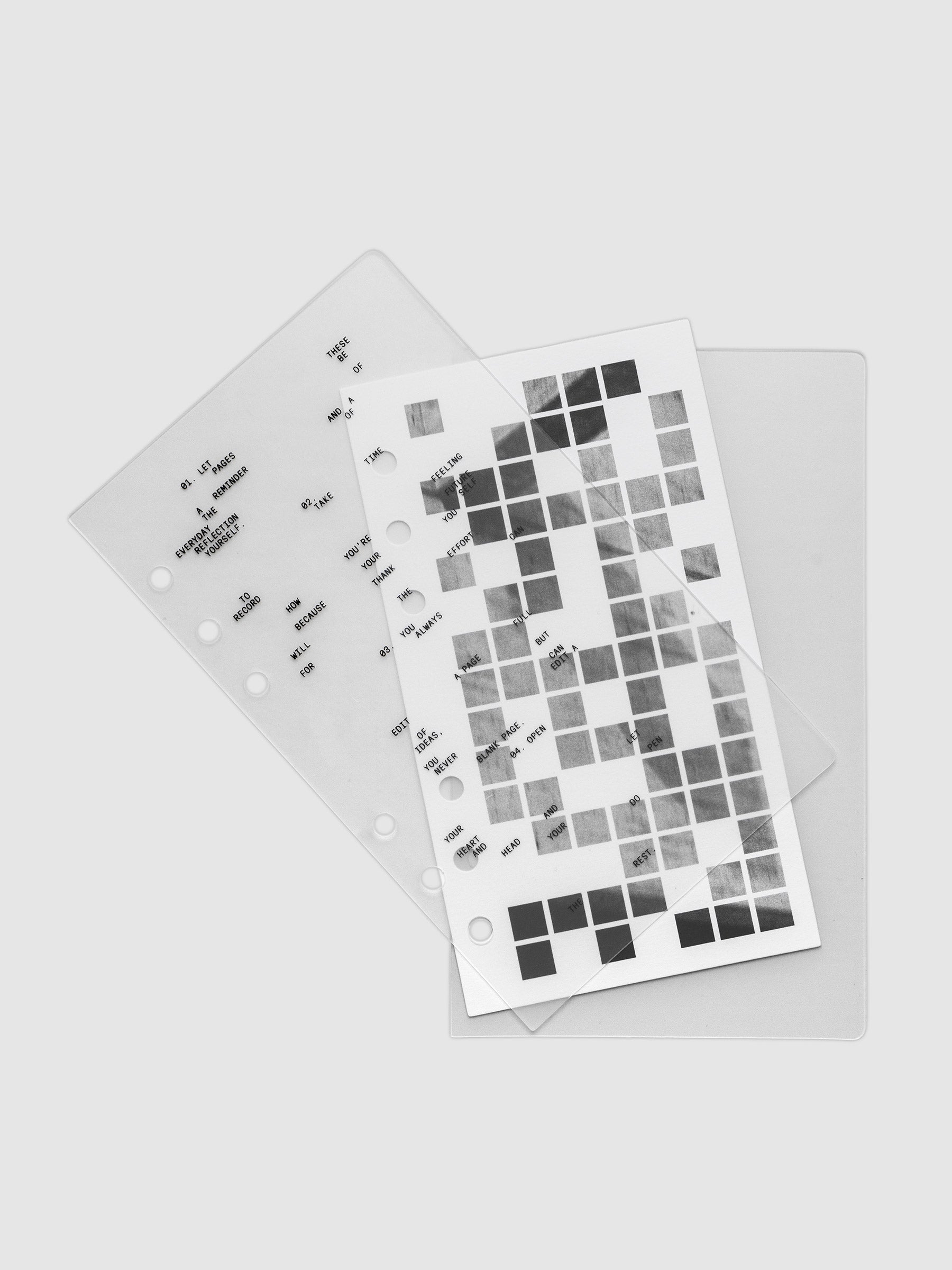 Clear planner cover with black printed text paired with a photographic black and white dashboard. Shown pre-punched for 6-ring planners in the size Personal.