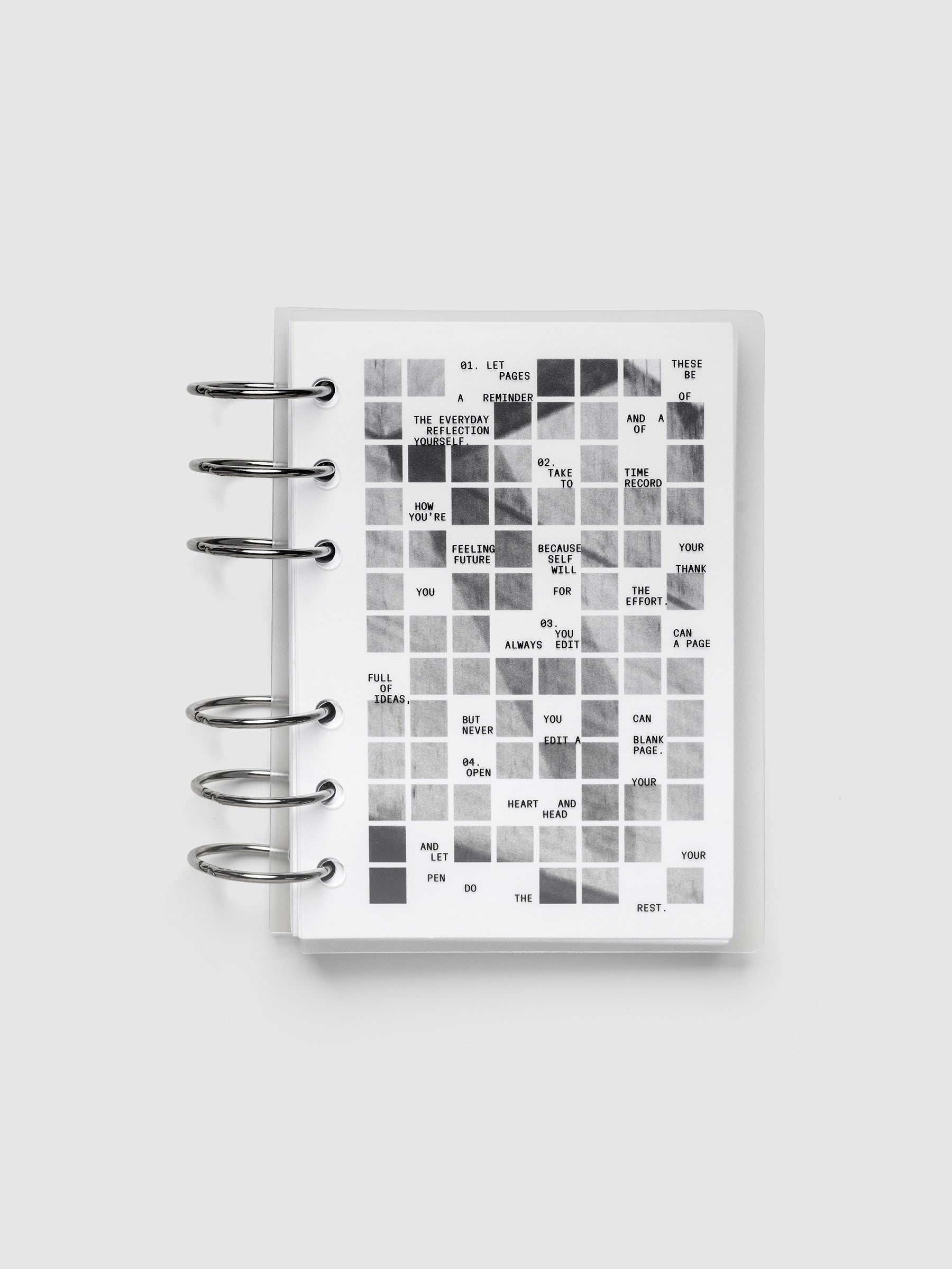 Clear planner cover with black printed text paired with a photographic black and white dashboard. Shown pre-punched for 6-ring planners in the size A6.