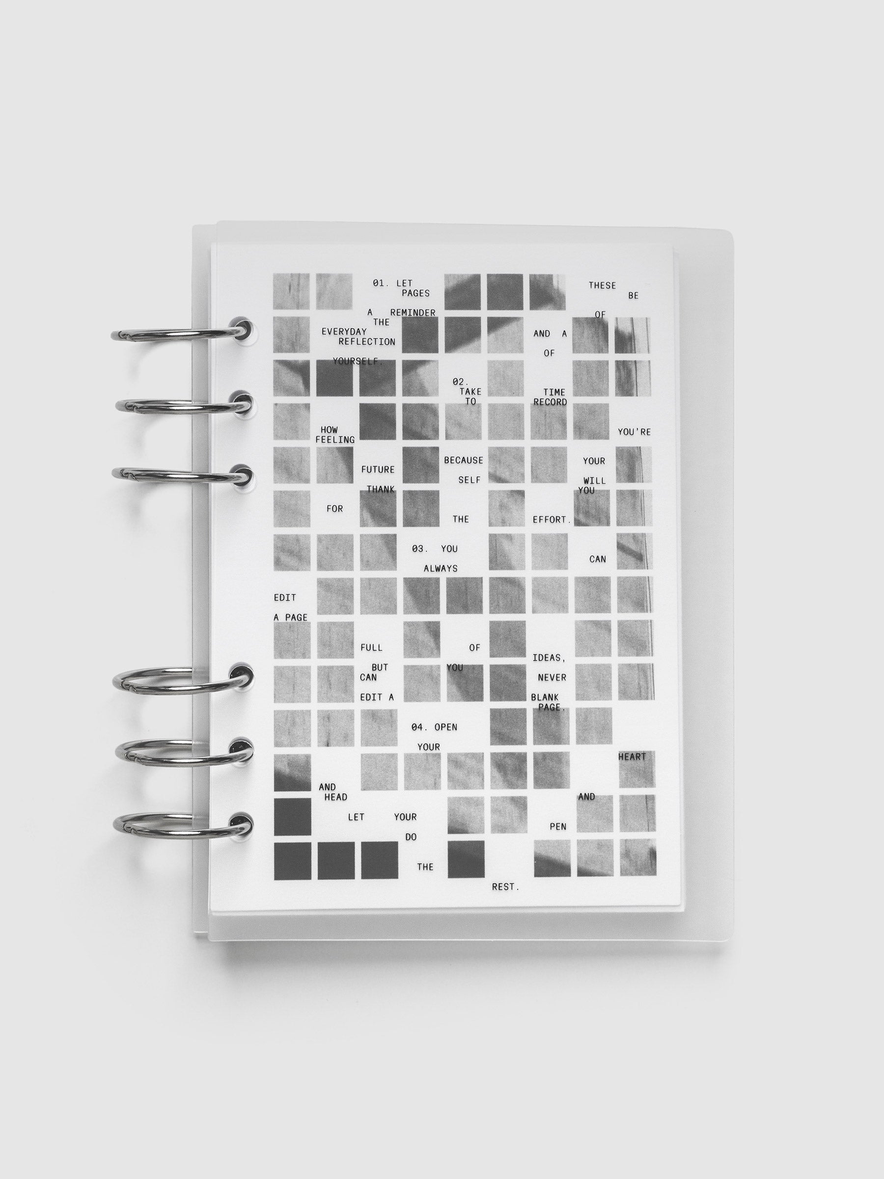 Clear planner cover with black printed text paired with a photographic black and white dashboard. Shown pre-punched for 6-ring planners in the size Personal Wide.