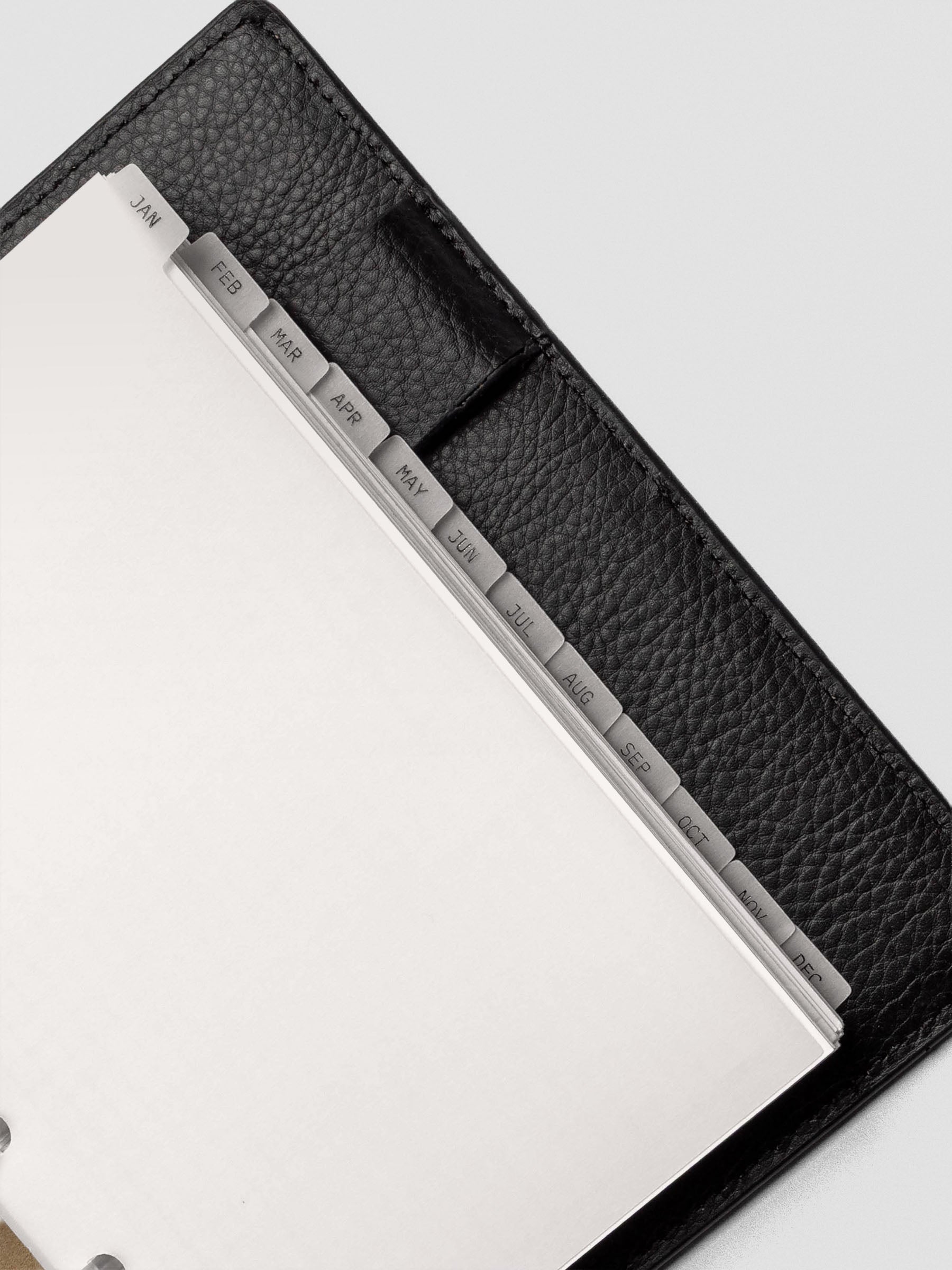 Close up of CP Petite vellum dividers shown at an angle bound with discs.