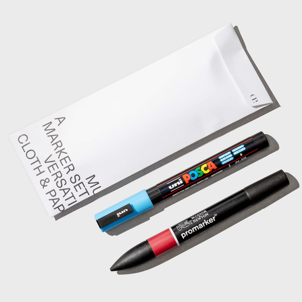 April 2024 Pen Set. Set of 2 markers displayed with their packaging on a neutral background.