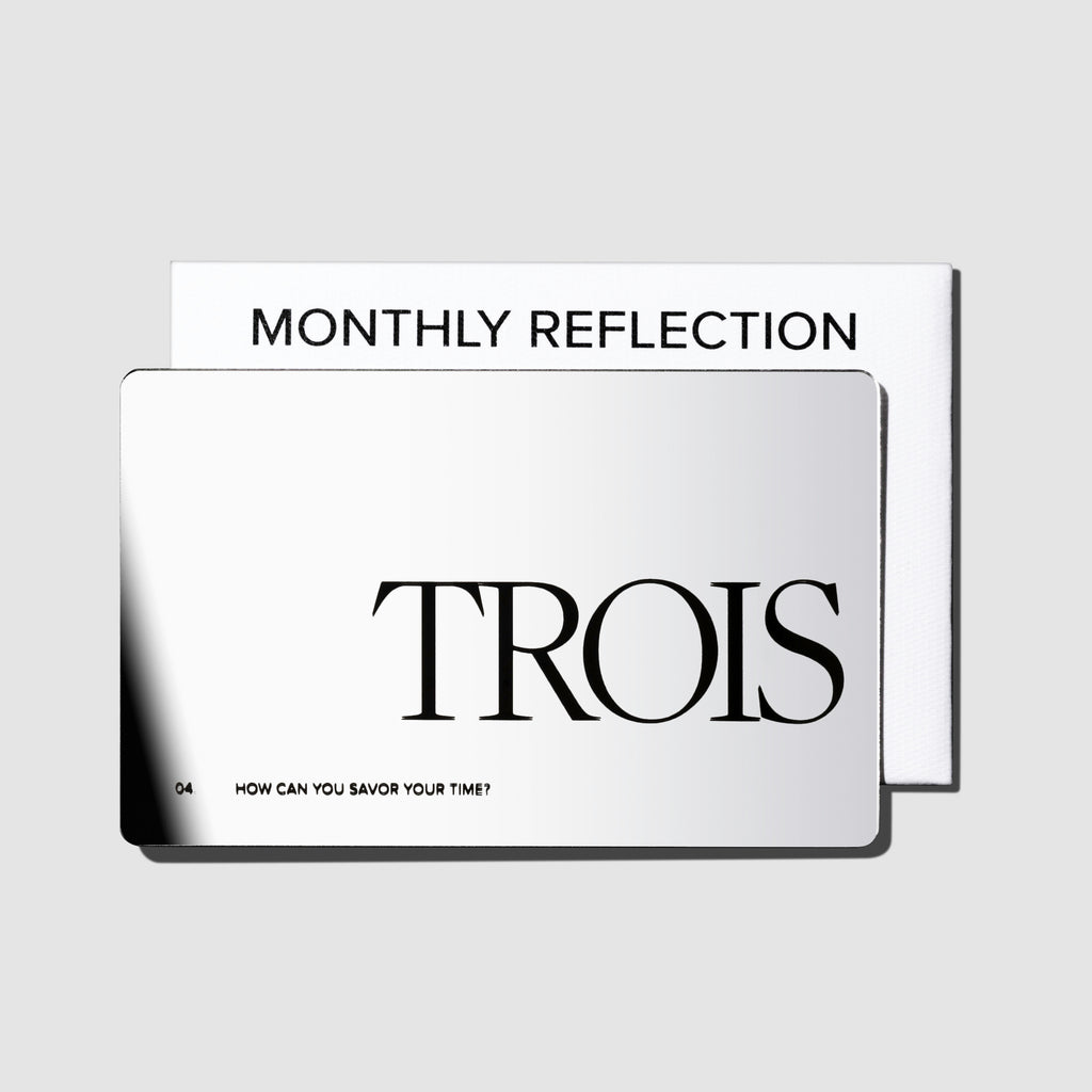 Reflective Prompt Card, Cloth and Paper. Card displayed with its packaging on a neutral background. Card reads "Trois | 04 | How can you savor your time?"