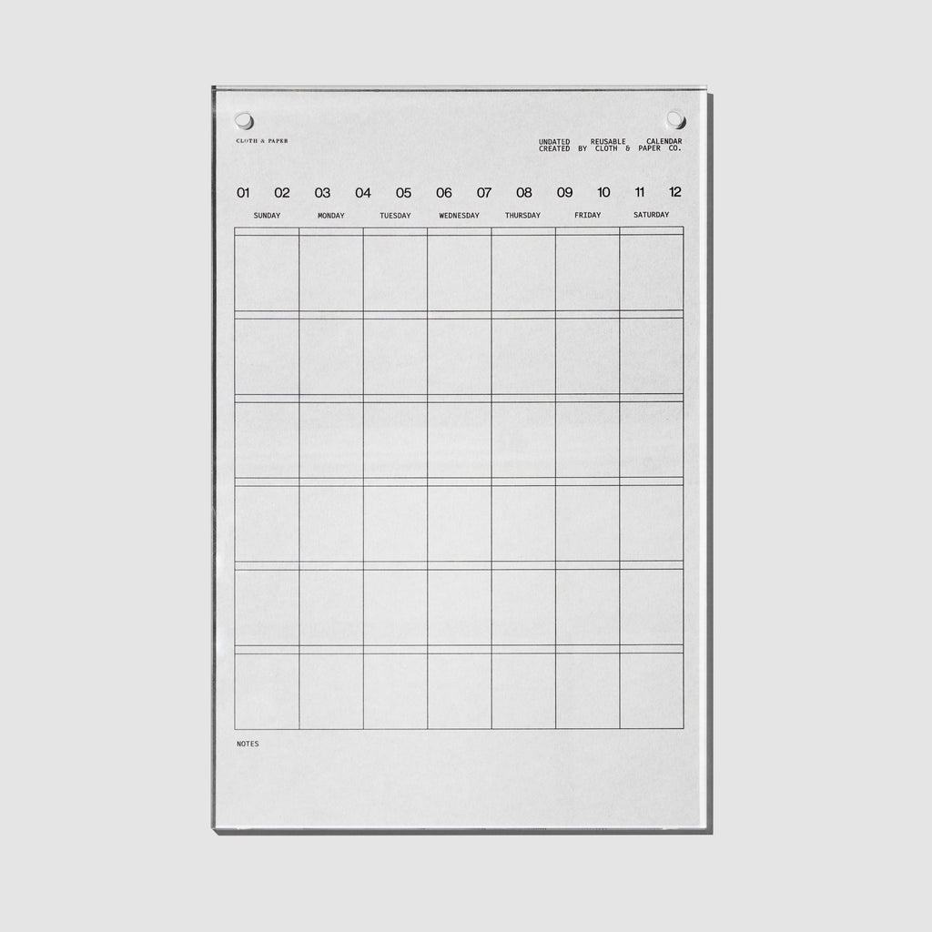 Undated Acrylic Calendar, Cloth and Paper. Calendar displayed on a neutral background.