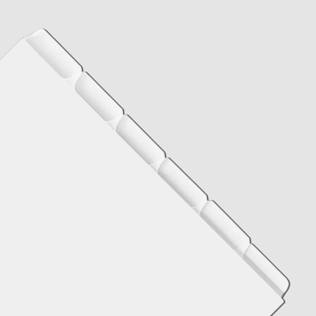 Closeup of blank divider tabs on a gray background.