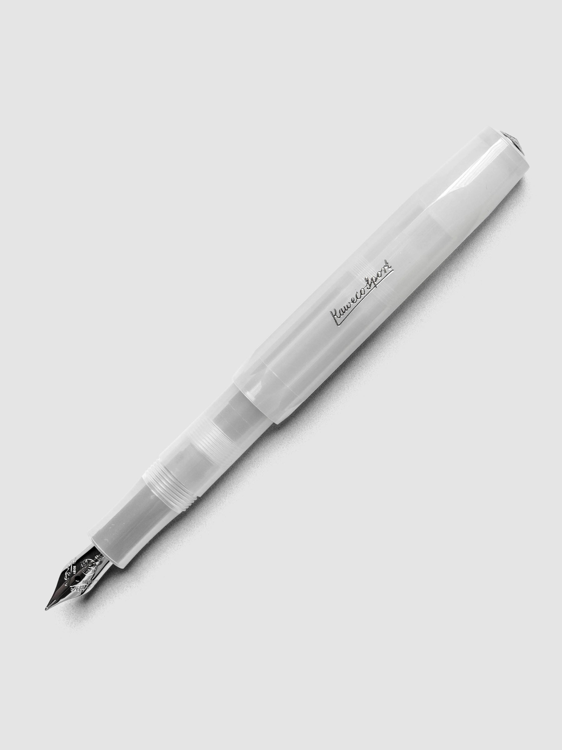 Clear fountain pen shown with cap posted.