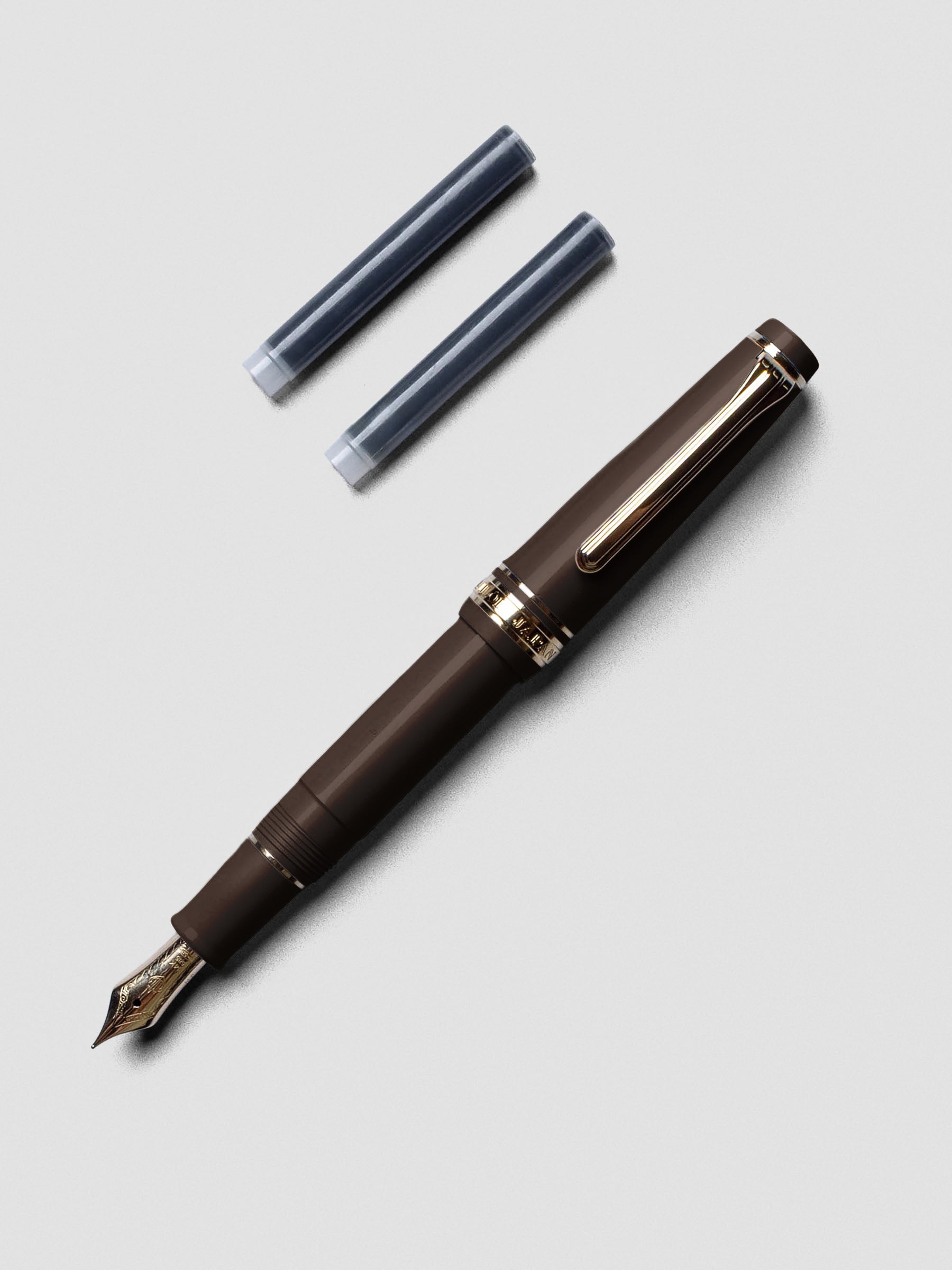 Sailor Pro Gear Slim Mini Fountain Pen in Puff Brown with cap posted on barrel.