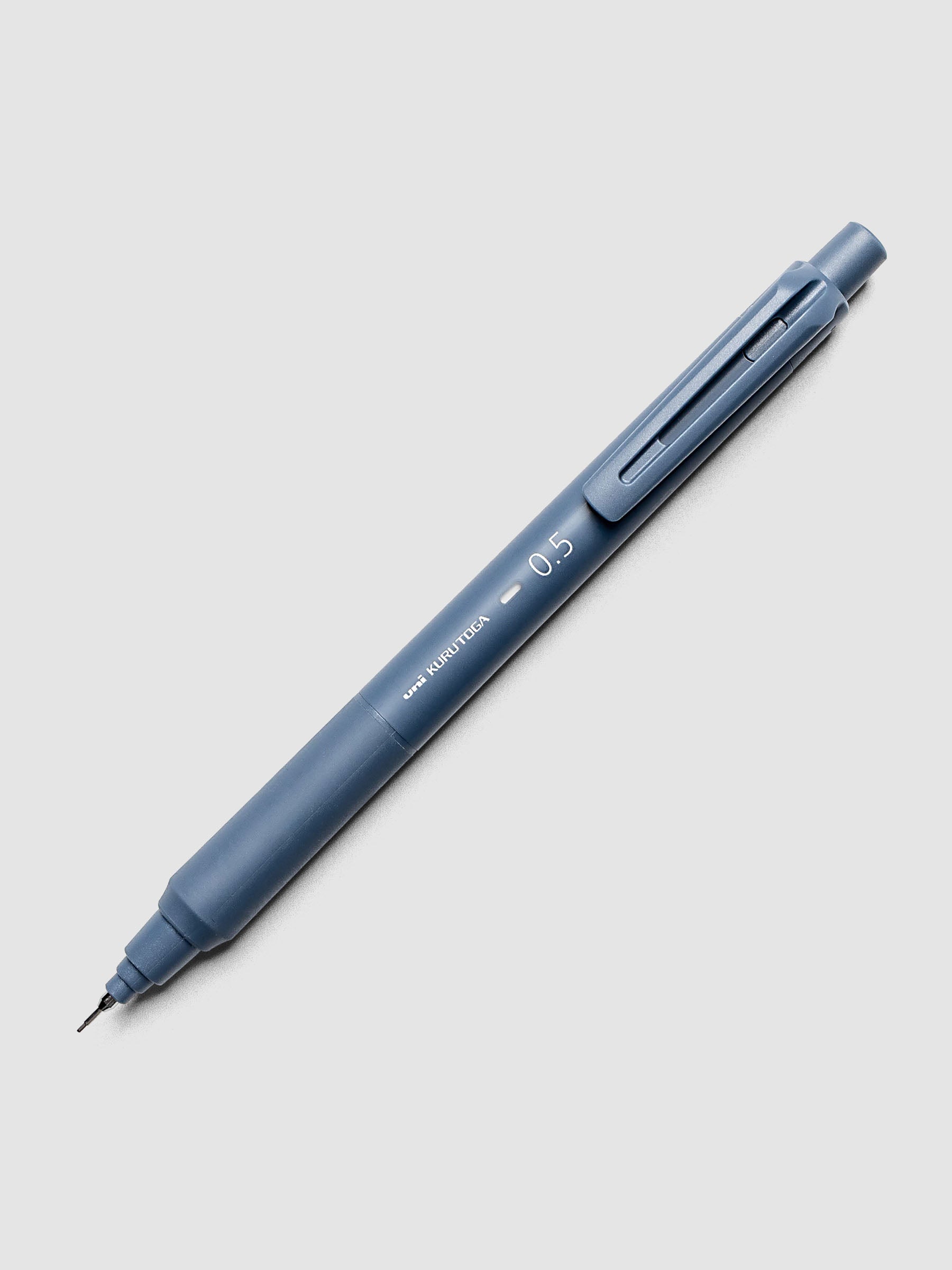 Uni Kuru Toga KS Mechanical Pencil Iron Blue laid diagonally showing clip and grip