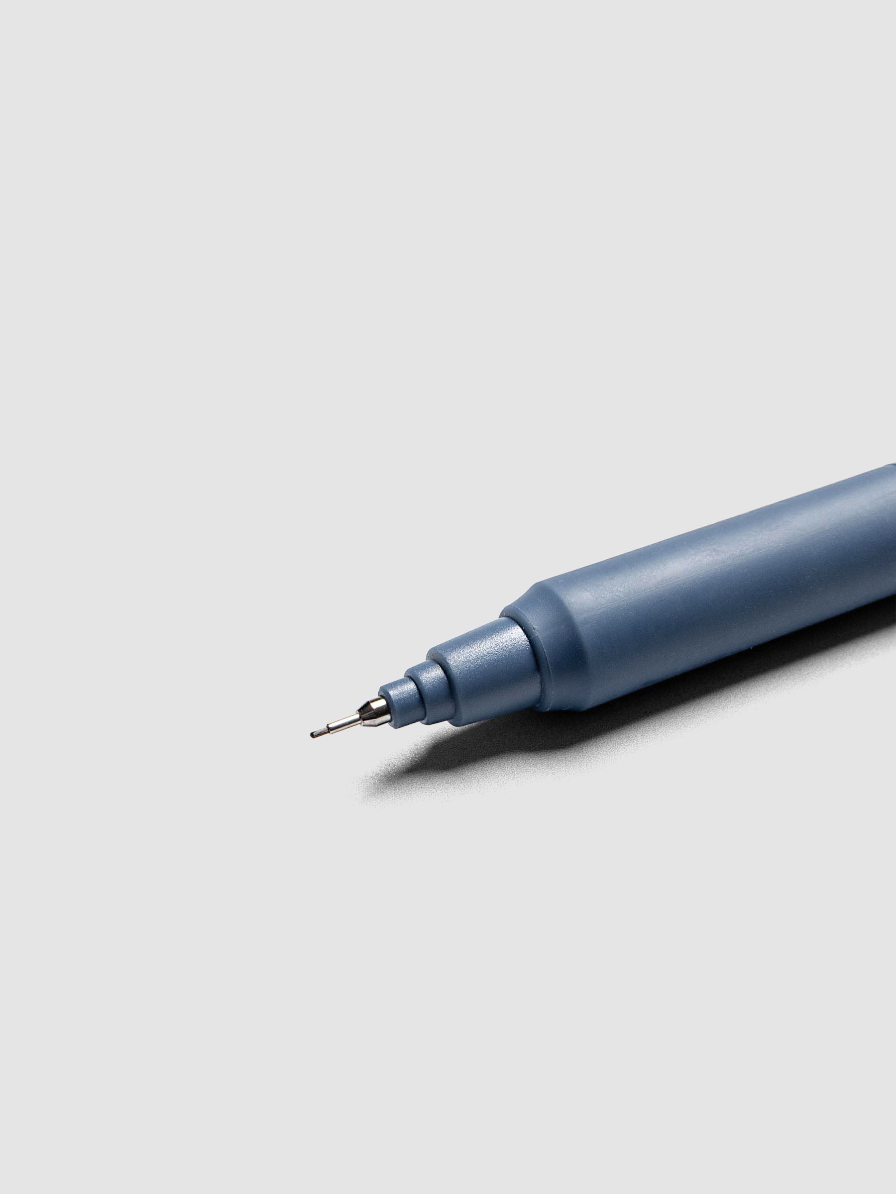 Uni Kuru Toga KS Mechanical Pencil Iron Blue close up of metal tip and lead sleeve