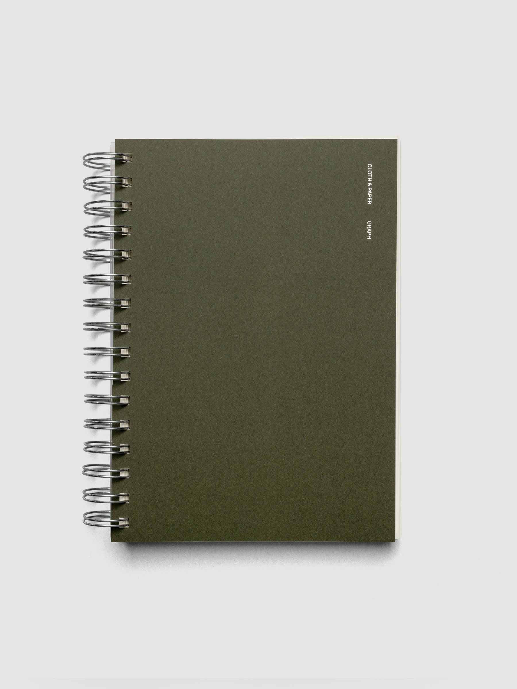 Spiral Notebook in size A5 and color Olive green with graph note interior pages shown closed.