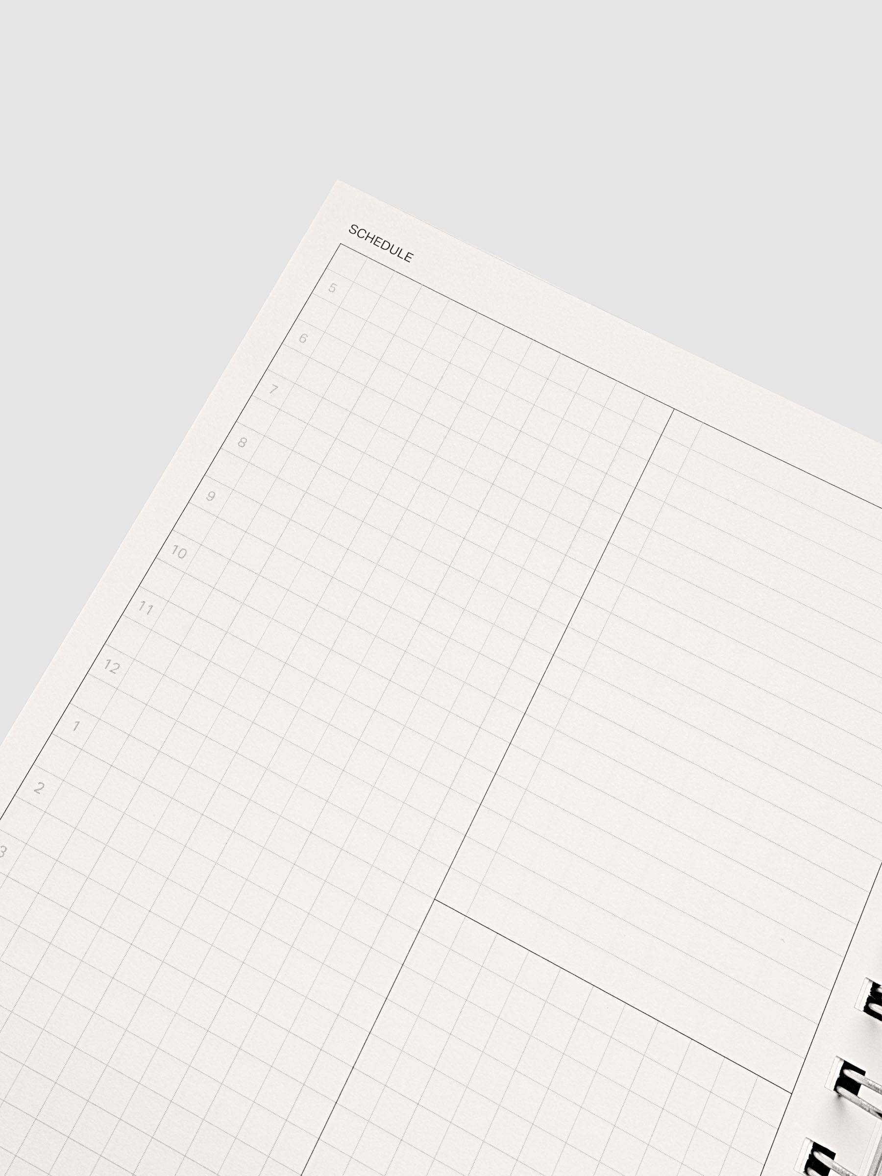 Spiral Notebook in size A5 and color Espresso brown with Daily Time Block interior pages shown open displaying time block schedule layout.