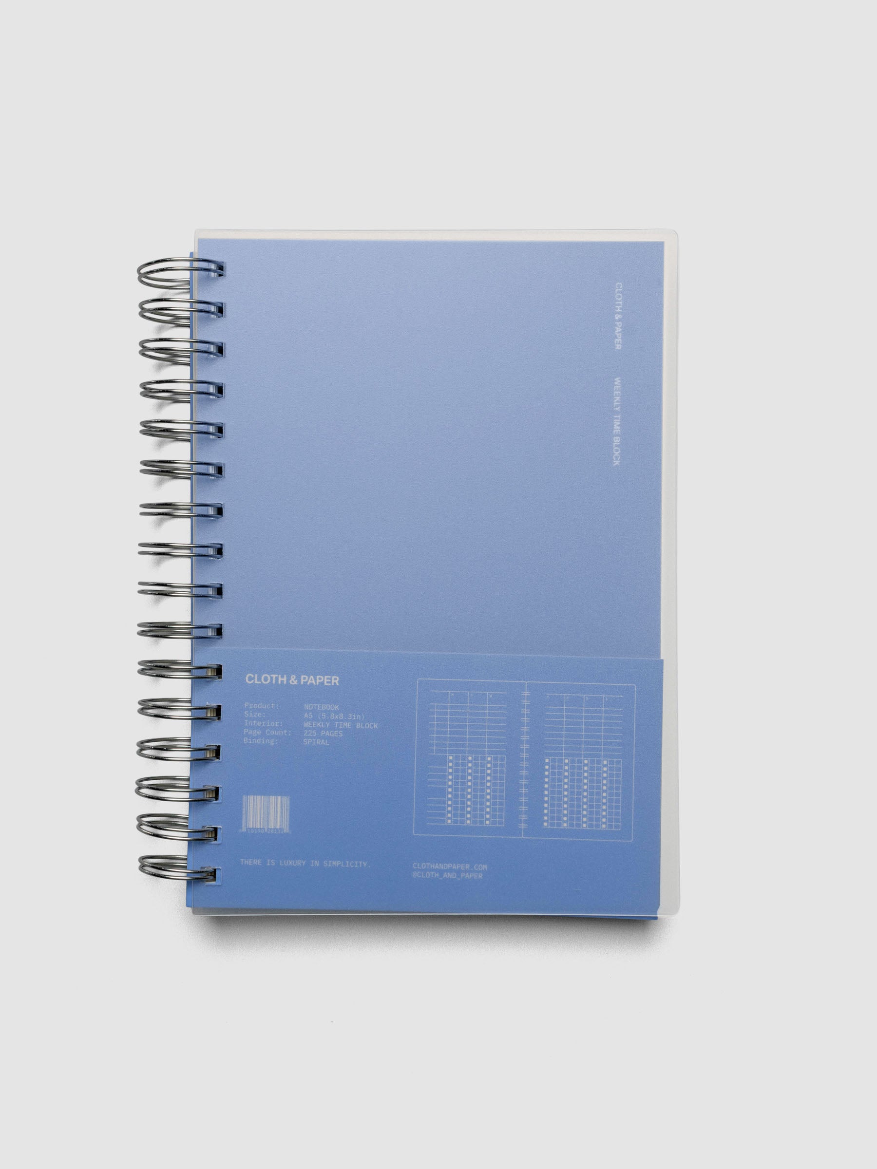 Spiral Notebook in size A5 and color Hyacinth blue with Weekly Time Block interior pages shown closed in packaging.