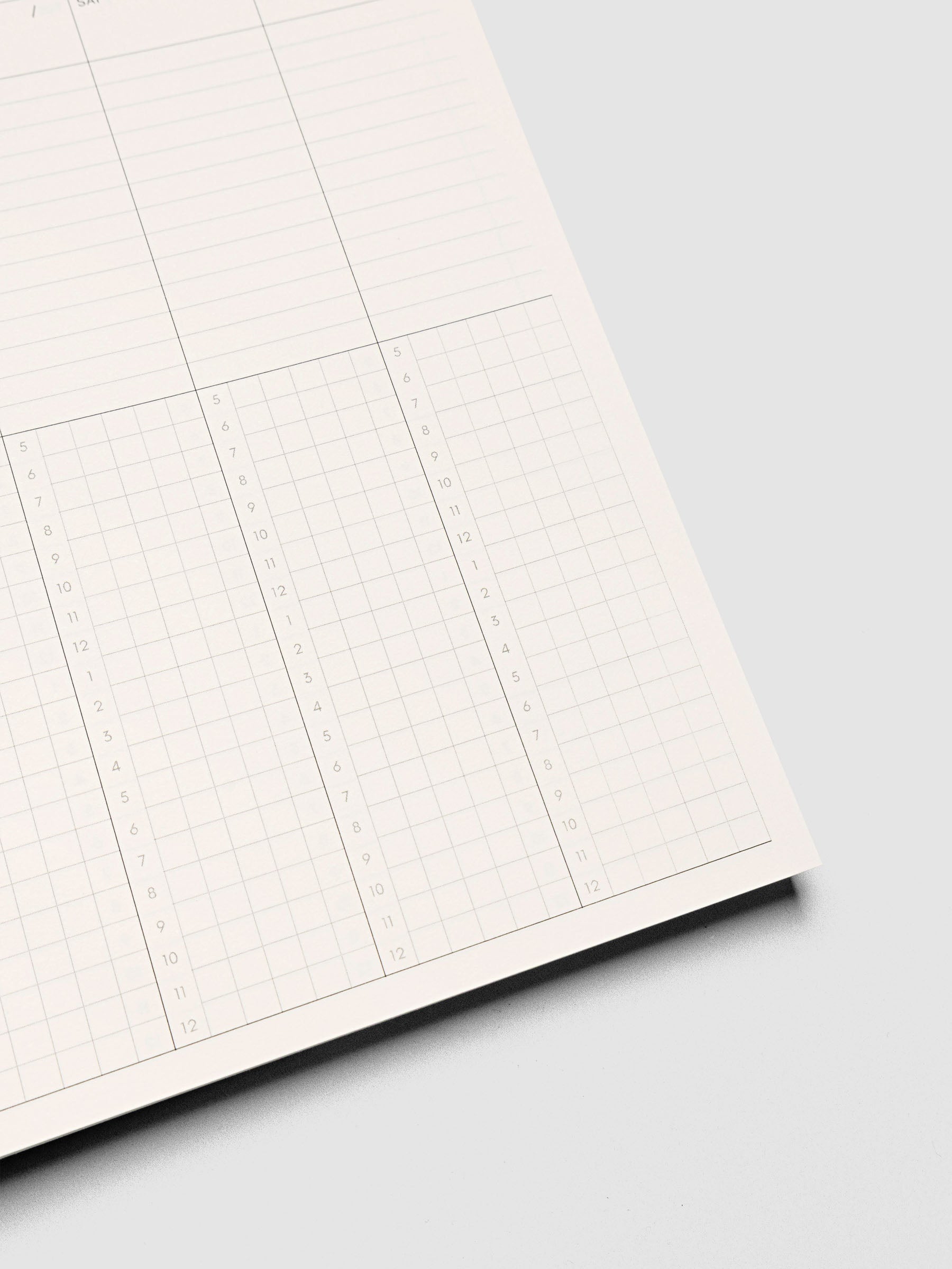 Spiral Notebook in size A5 and color Hyacinth blue shown open and close up displaying vertical weekly time block layout.