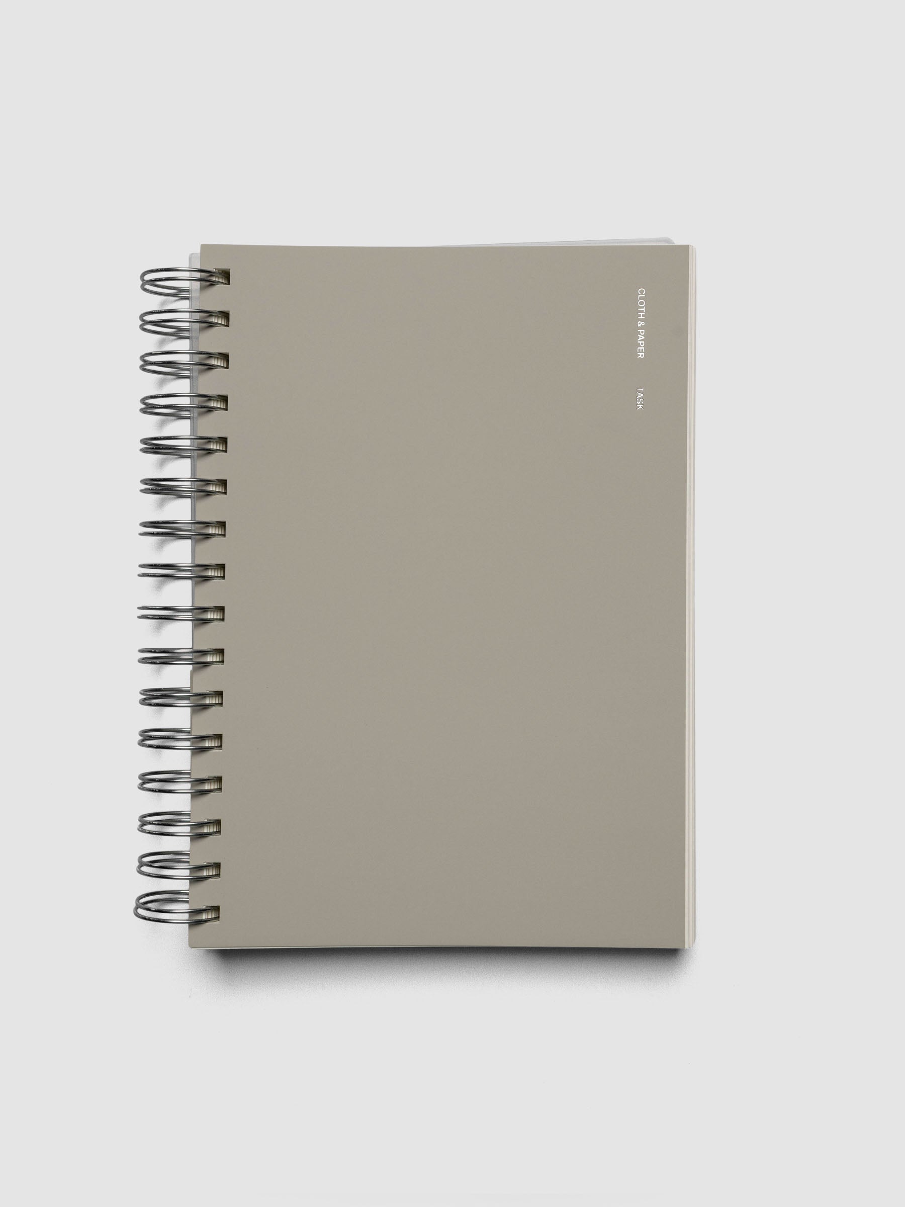 Spiral Notebook in size A5 and color Ristretto beige with Task interior pages shown closed.