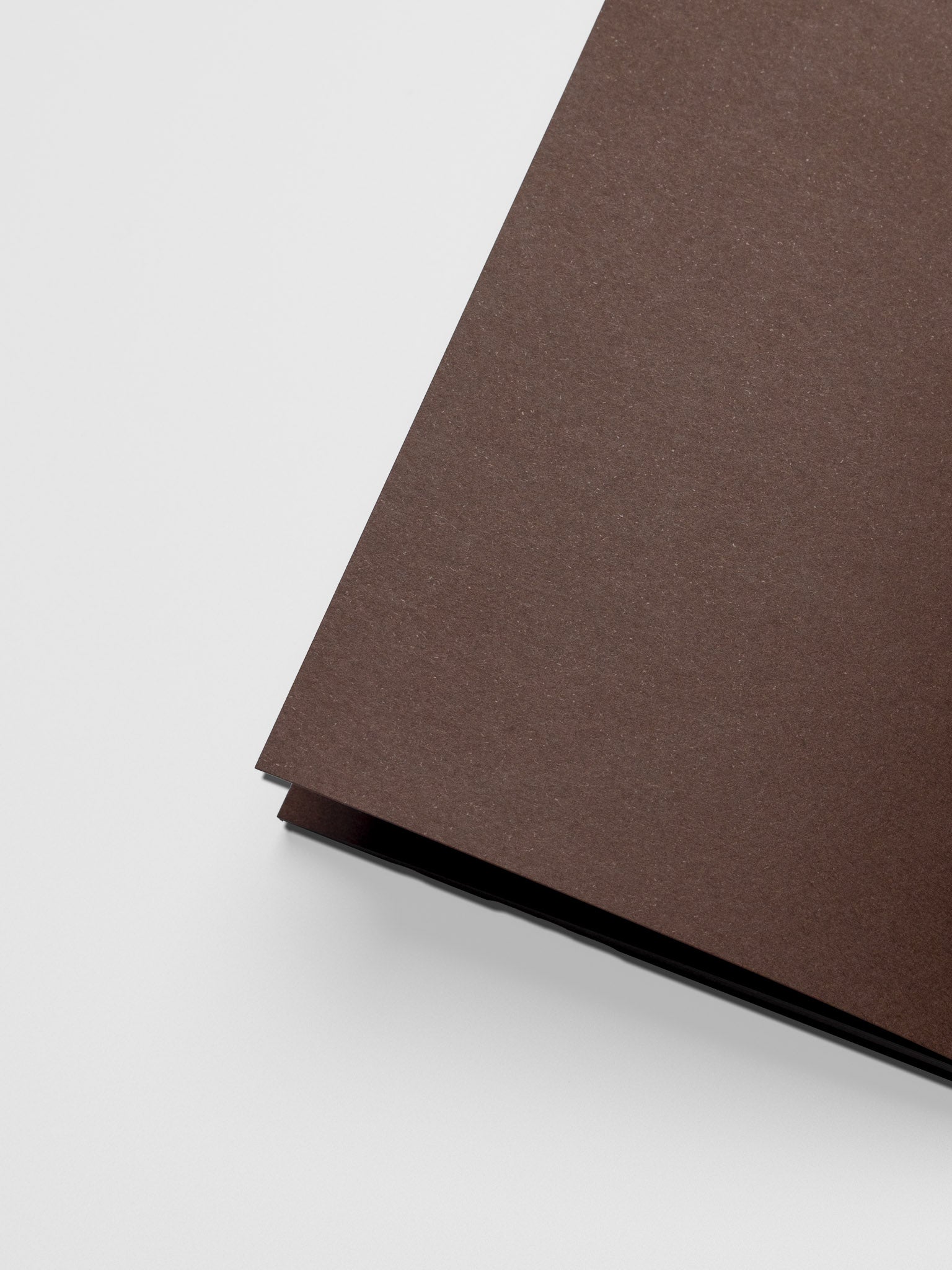 Close up of the Common Thread Notebook showing the brown, blank interior pages.