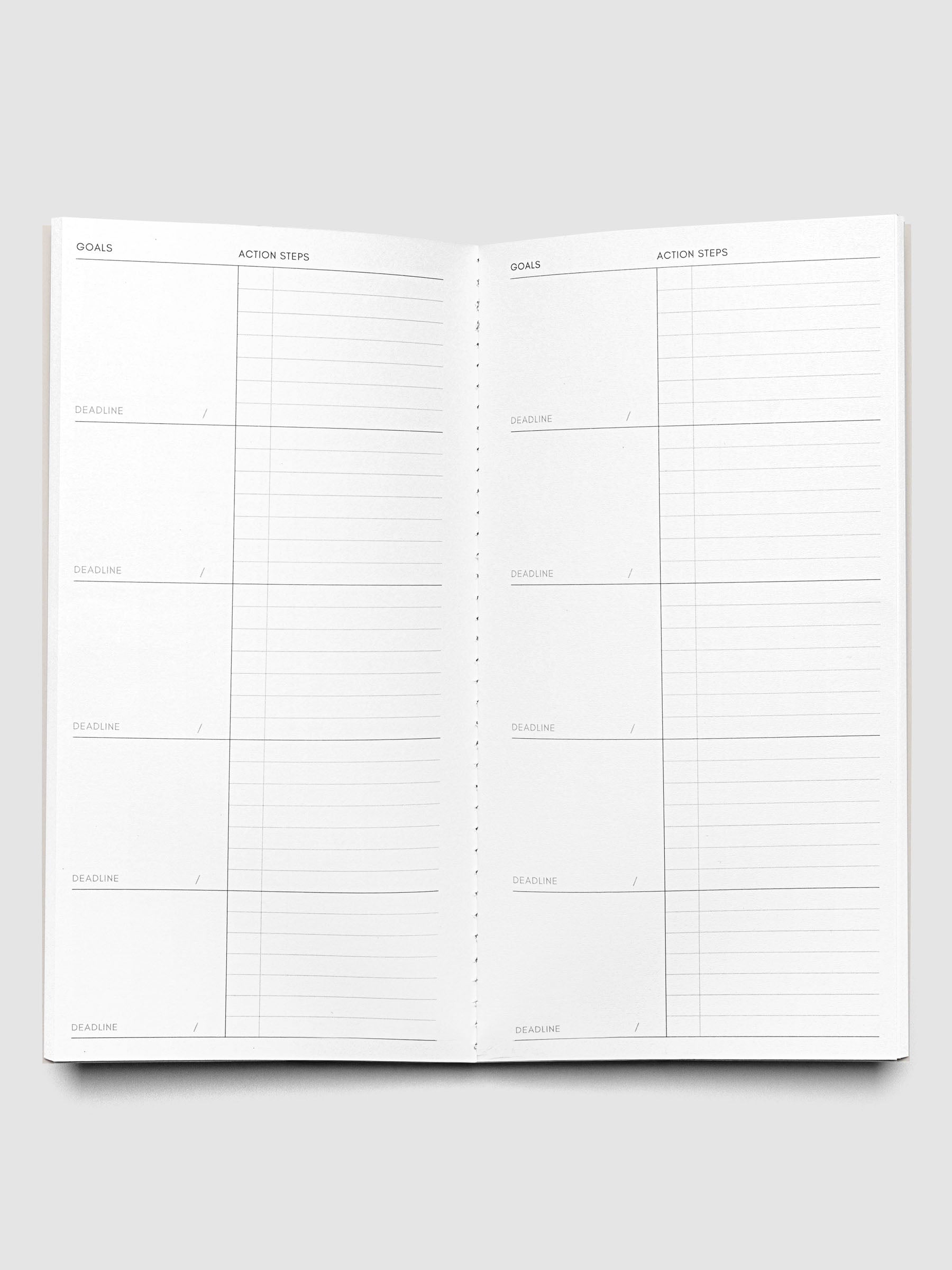 Interior of Travel Notebook in size A5 Slim in color Ibiza with Goal Tracking pages.